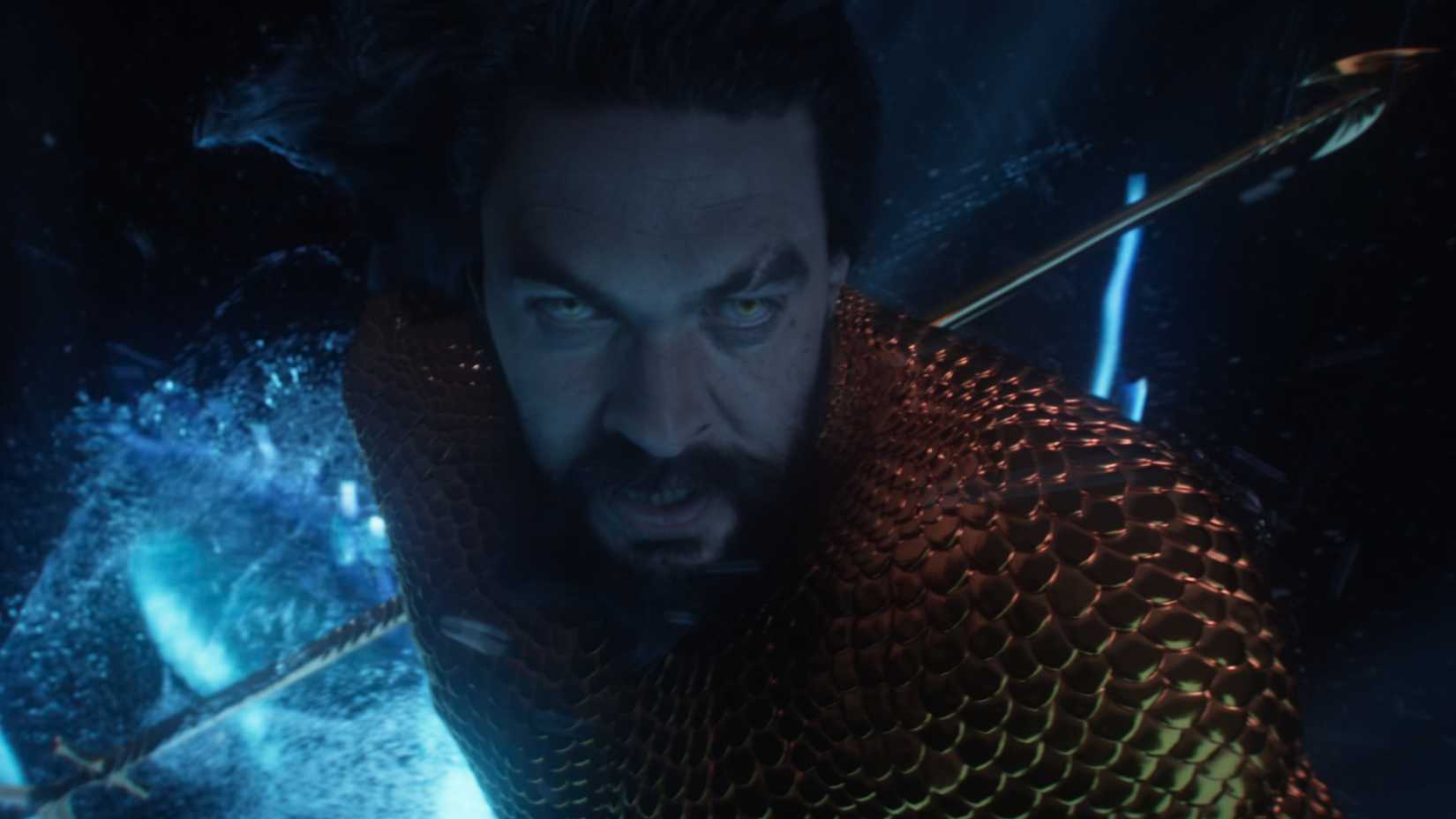 Aquaman underwater holding his trident