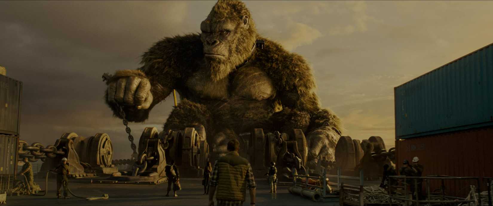 King Kong towering above humans while chained