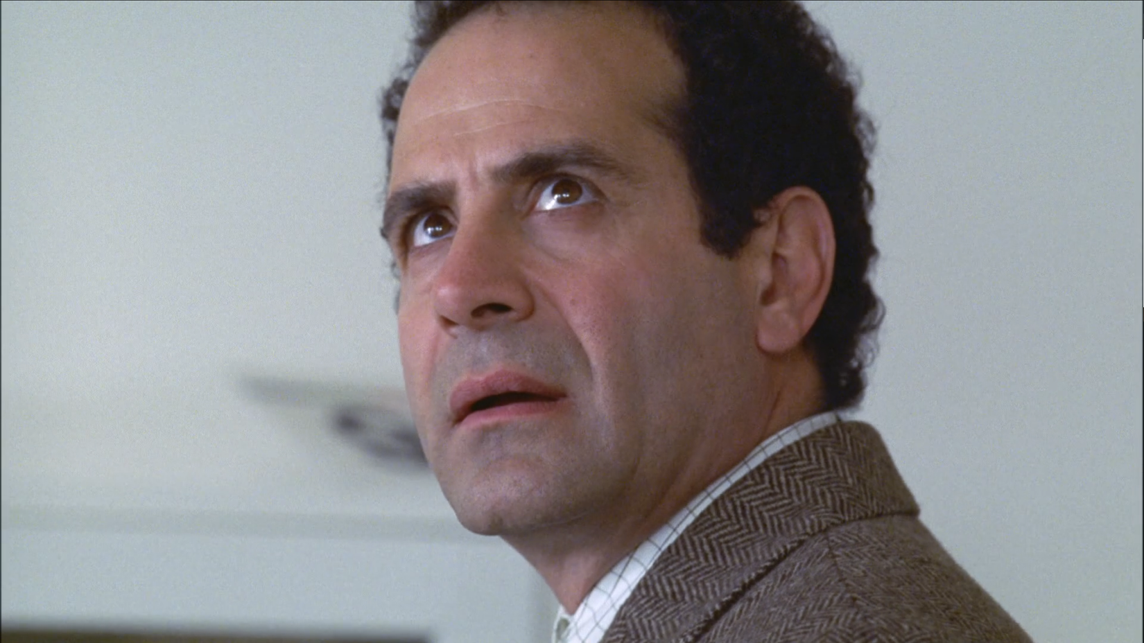 Adrian Monk staring up at the ceiling