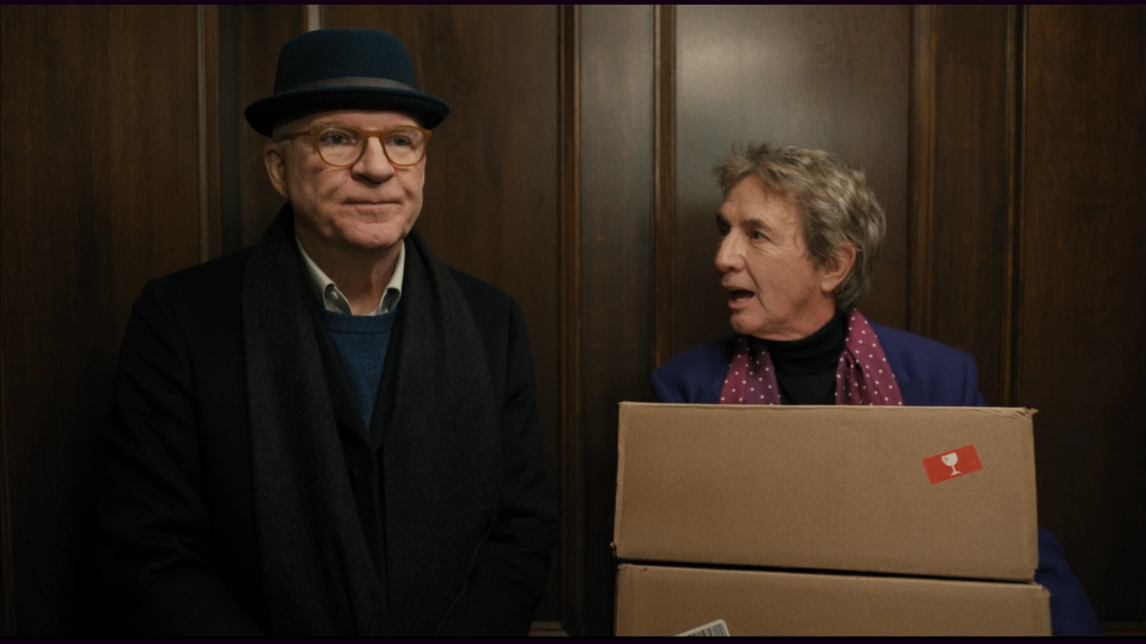 Steve Martin and Martin Short talking in an elevator