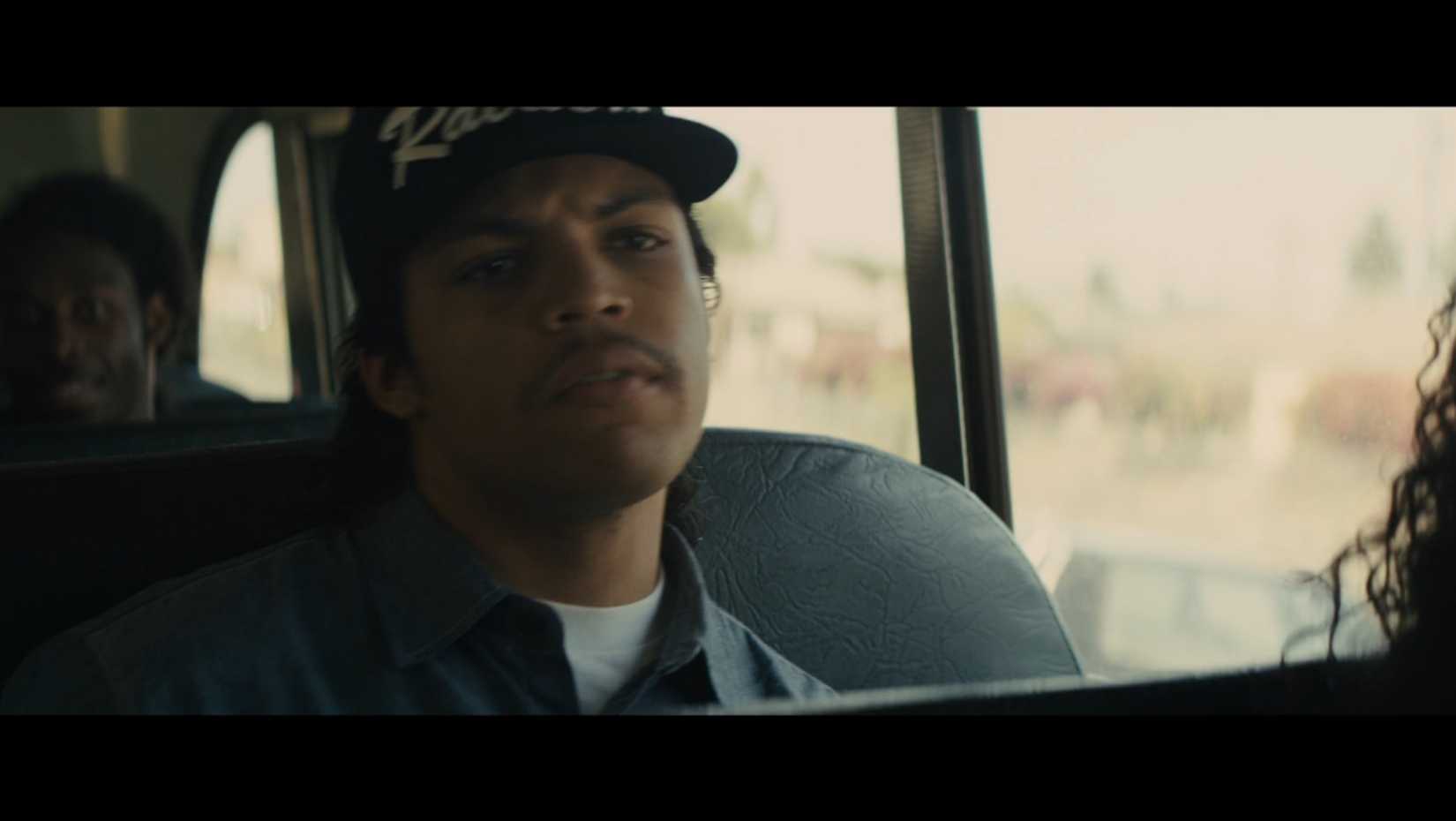 O'Shea Jackson Jr. sitting on a bus looking concerned