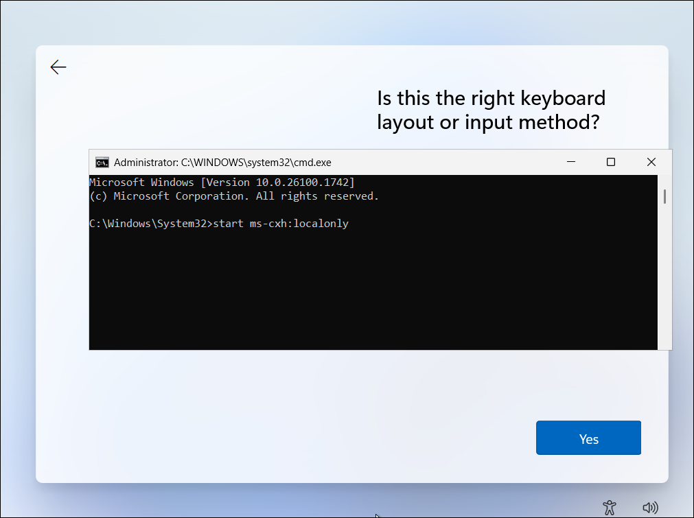 Windows 11 set up screen with an option to select the keyboard language and command prompt open