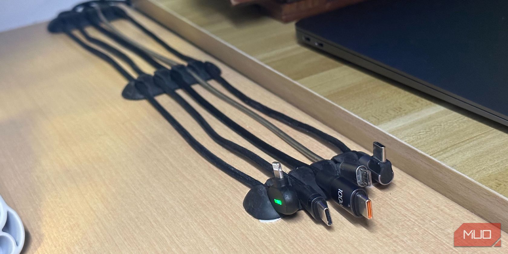 Charging cables organized with rubber clips