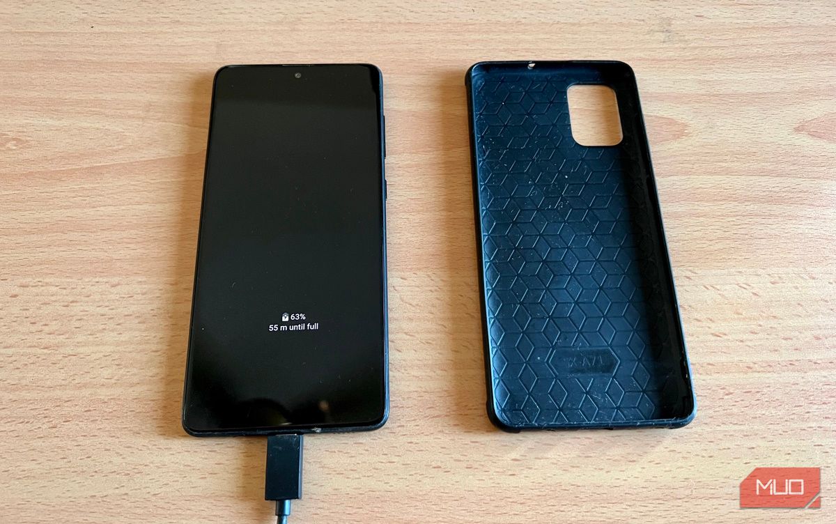 A smartphone and its case on a table
