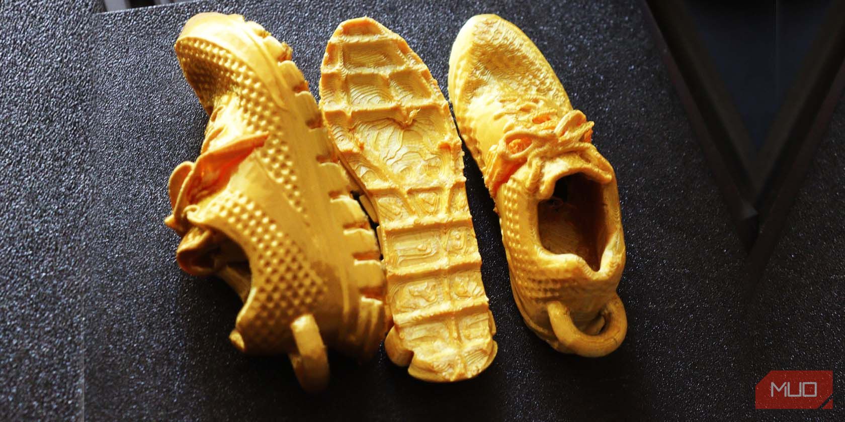 Two 3D printed shoes and a sole