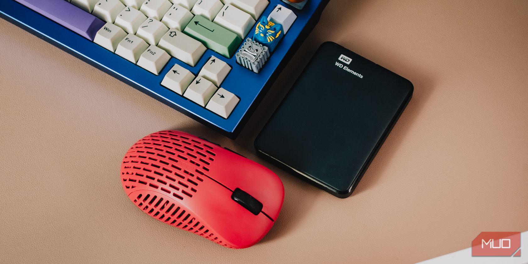 External hard drive next to mouse and keyboard