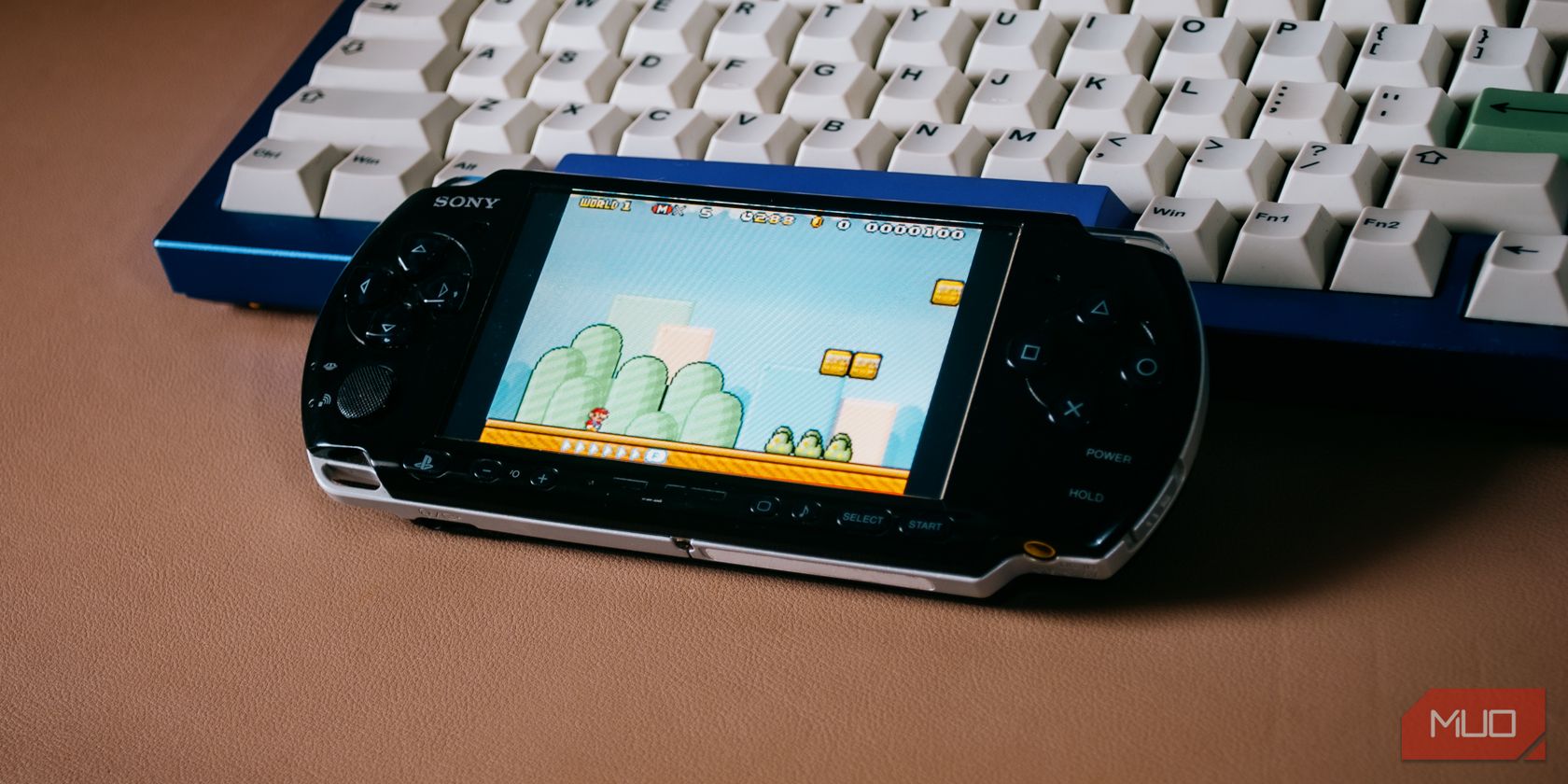 PSP on a keyboard playing Mario