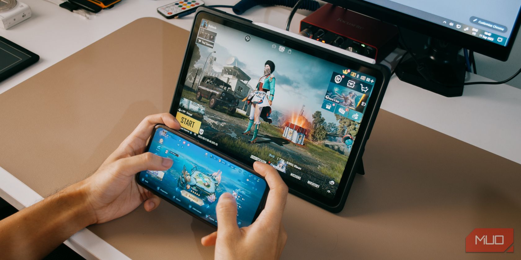 Tablet with PUBG and phone with Mobile Legends