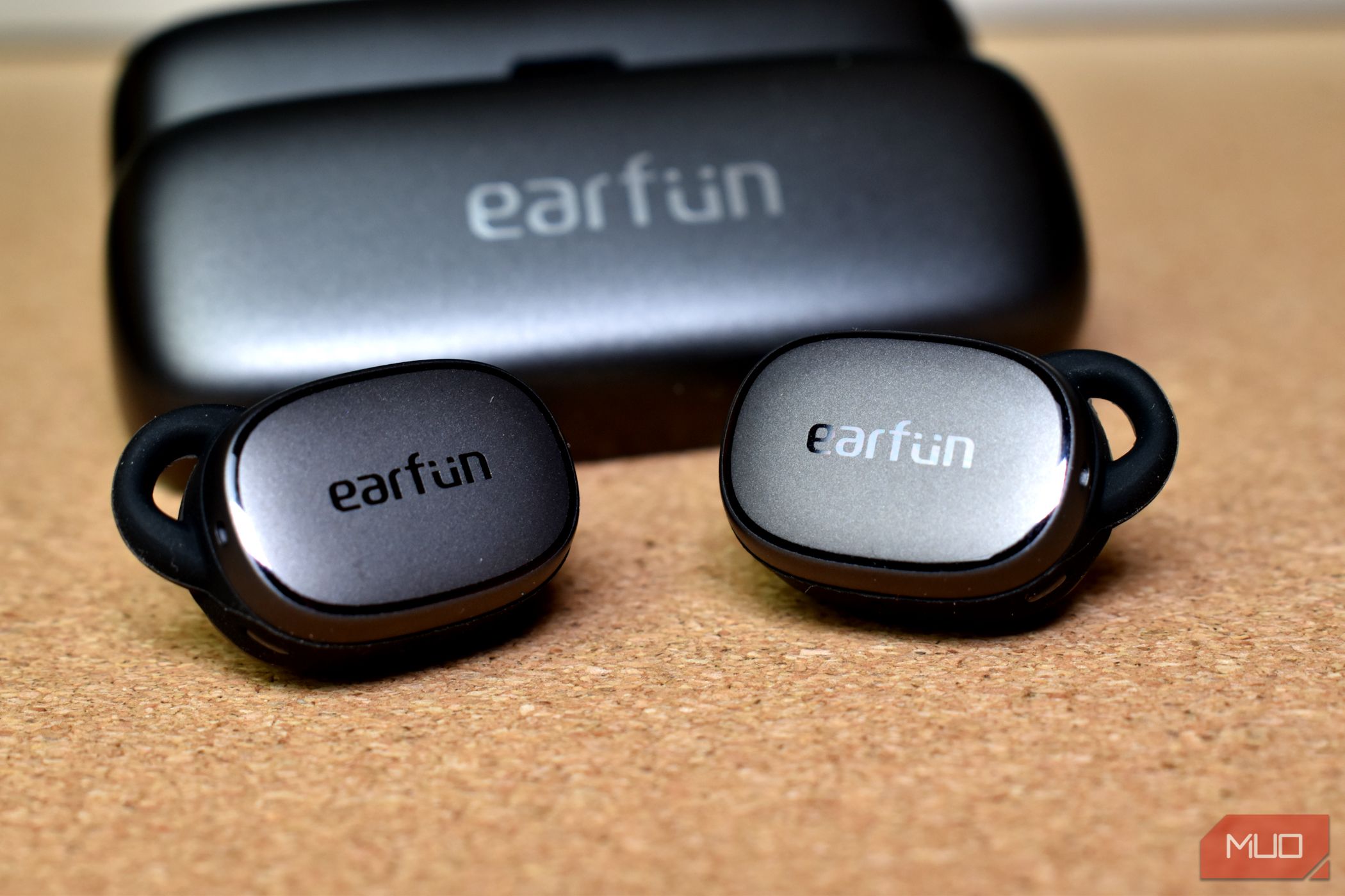 earfun free pro 3 earbuds in front of case side by side