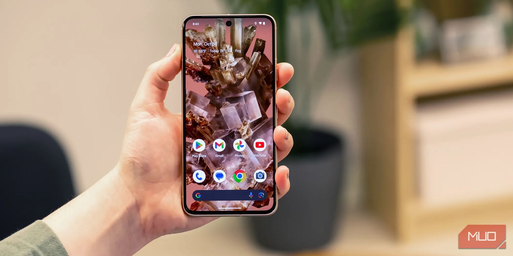 person holding a Google Pixel 8