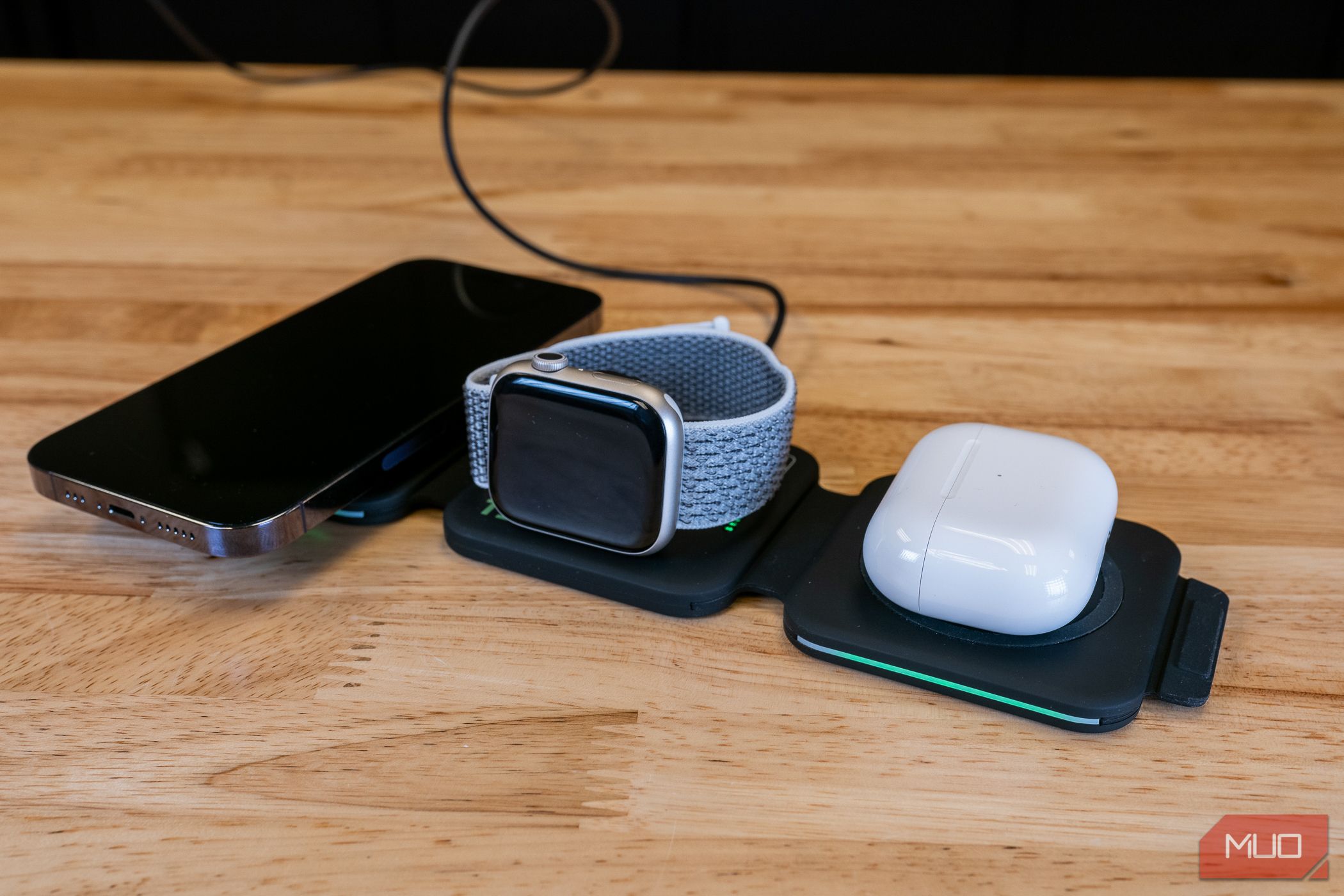 Infinacore T3 charging an iPhone, Apple Watch and Airpods