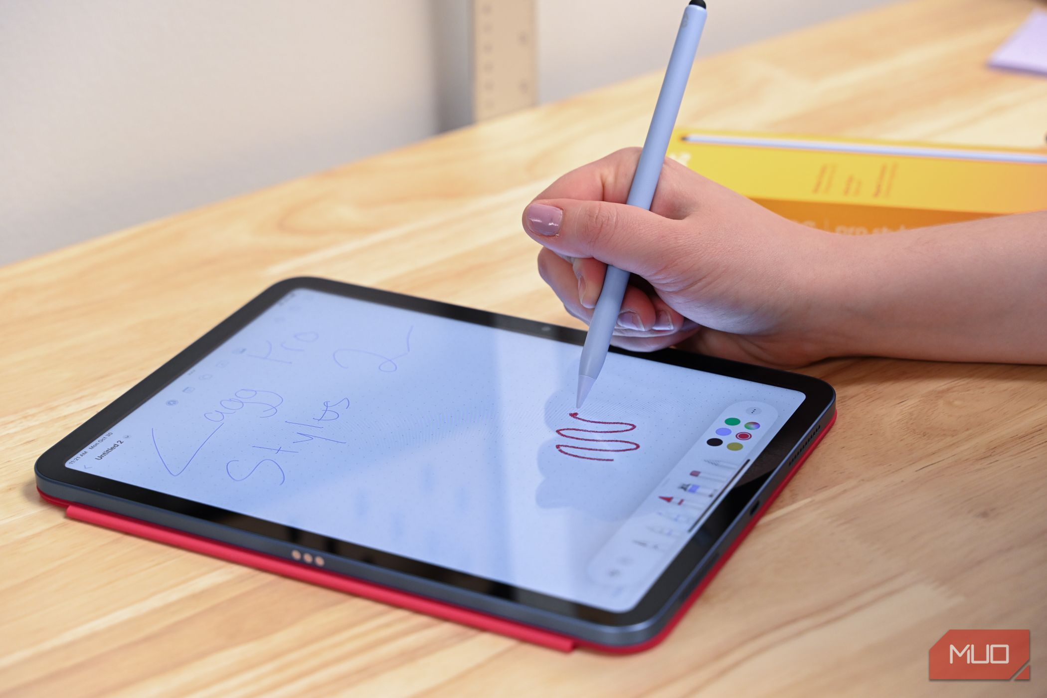 person drawing with the zagg pro stylus 2