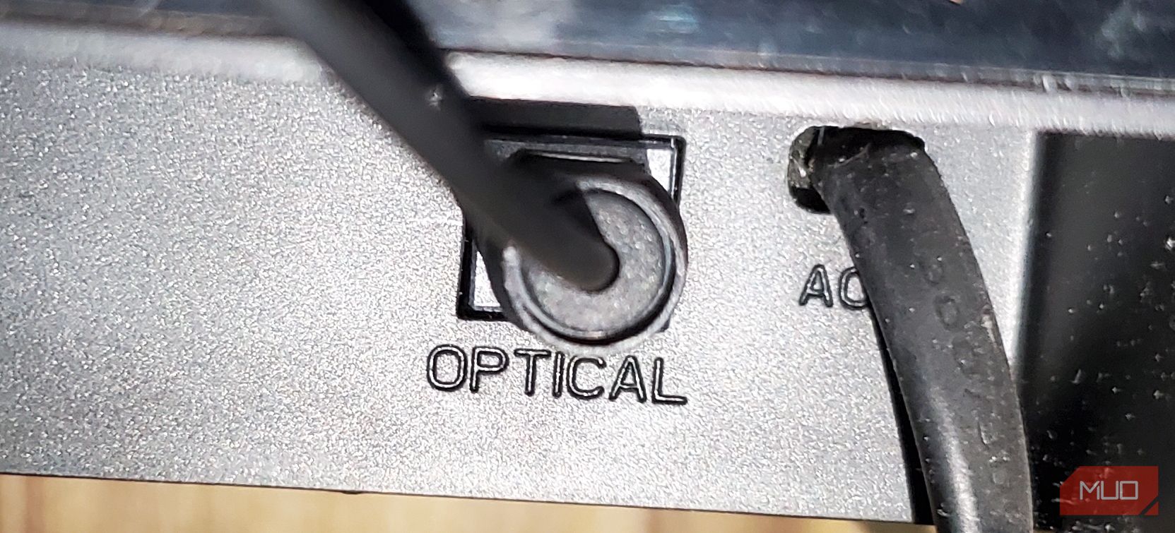 An optical cable plugged to the optical port of a Hisense soundbar