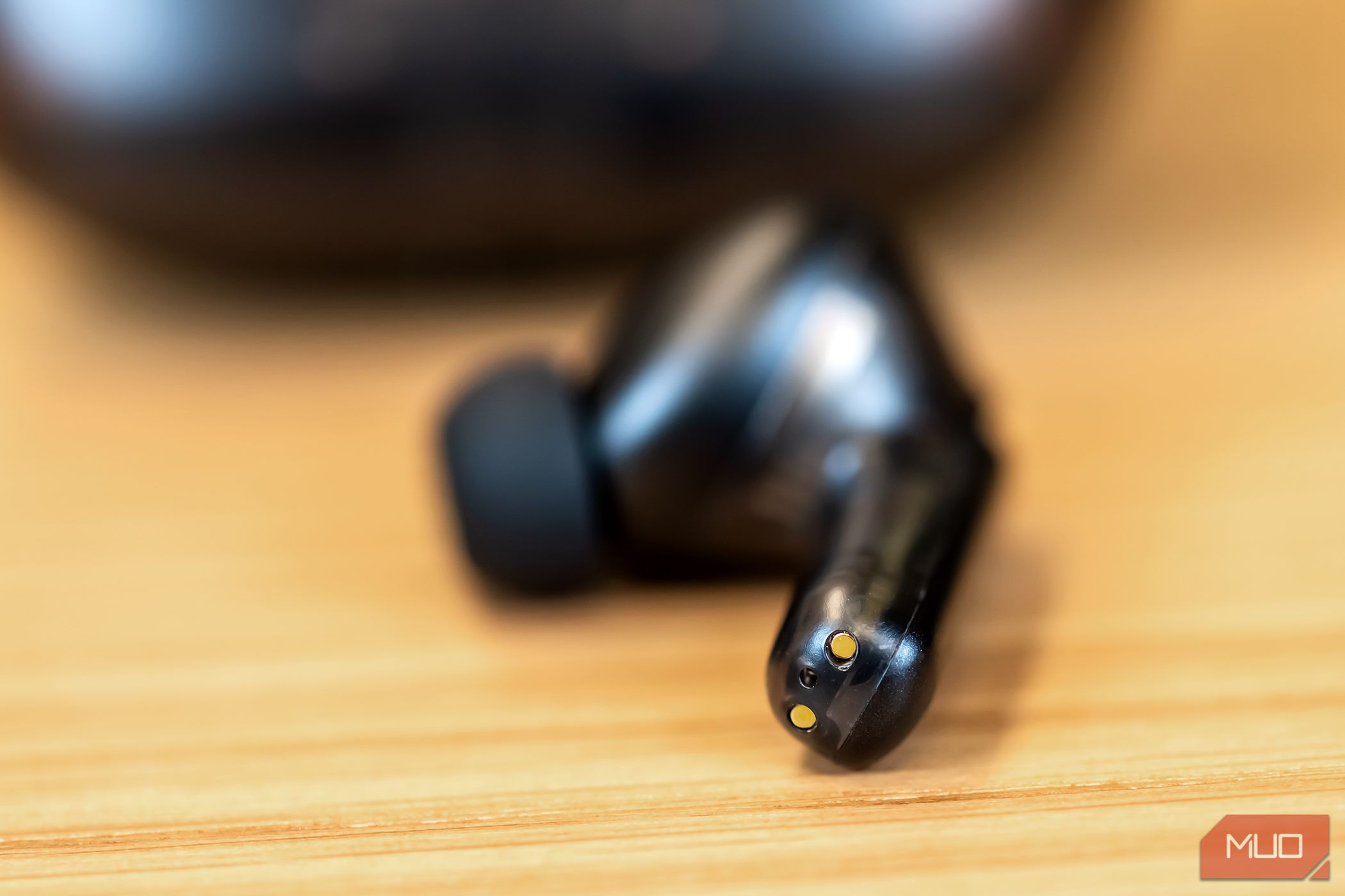 Charging connection points on a Creative Aurvana Ace 2 earbud