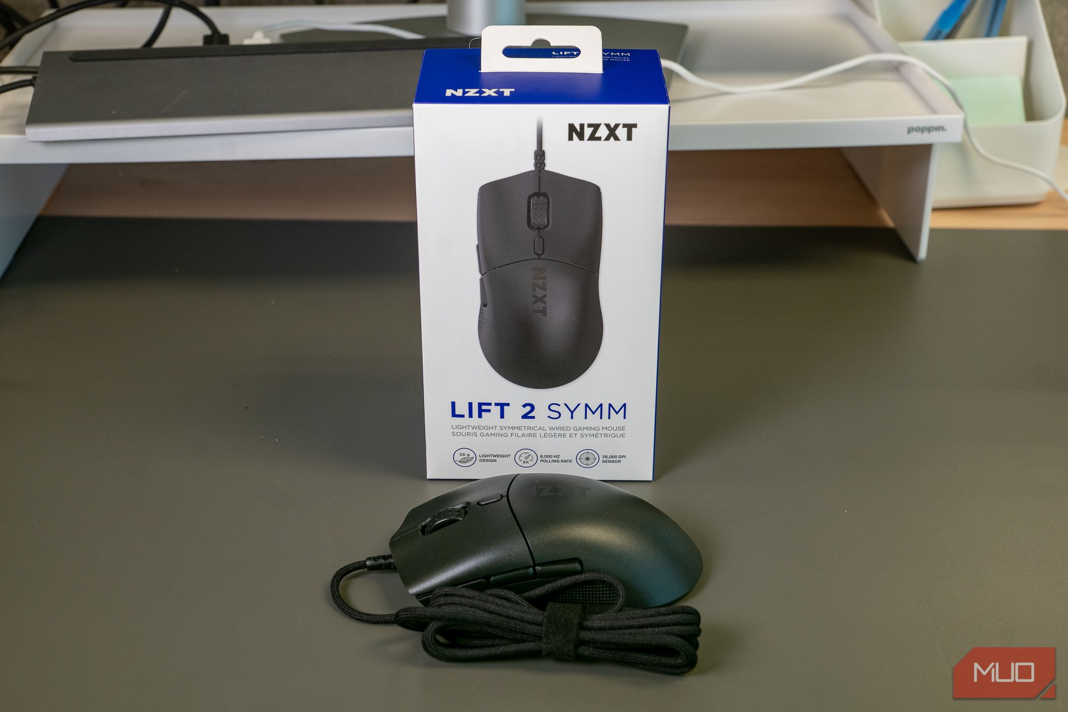NZXT Lift 2 Symm mouse in front of box