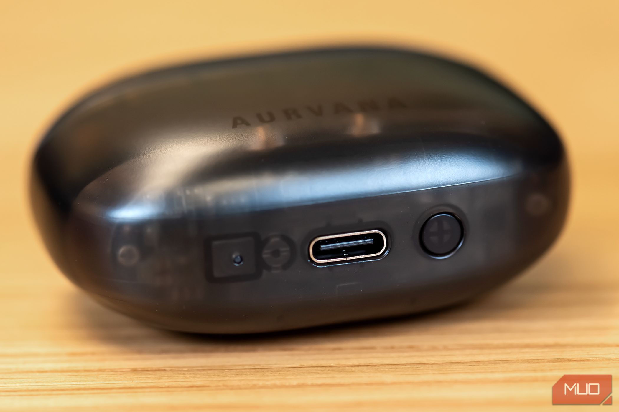 The charging port on the case of the Creative Aurvana Ace 2