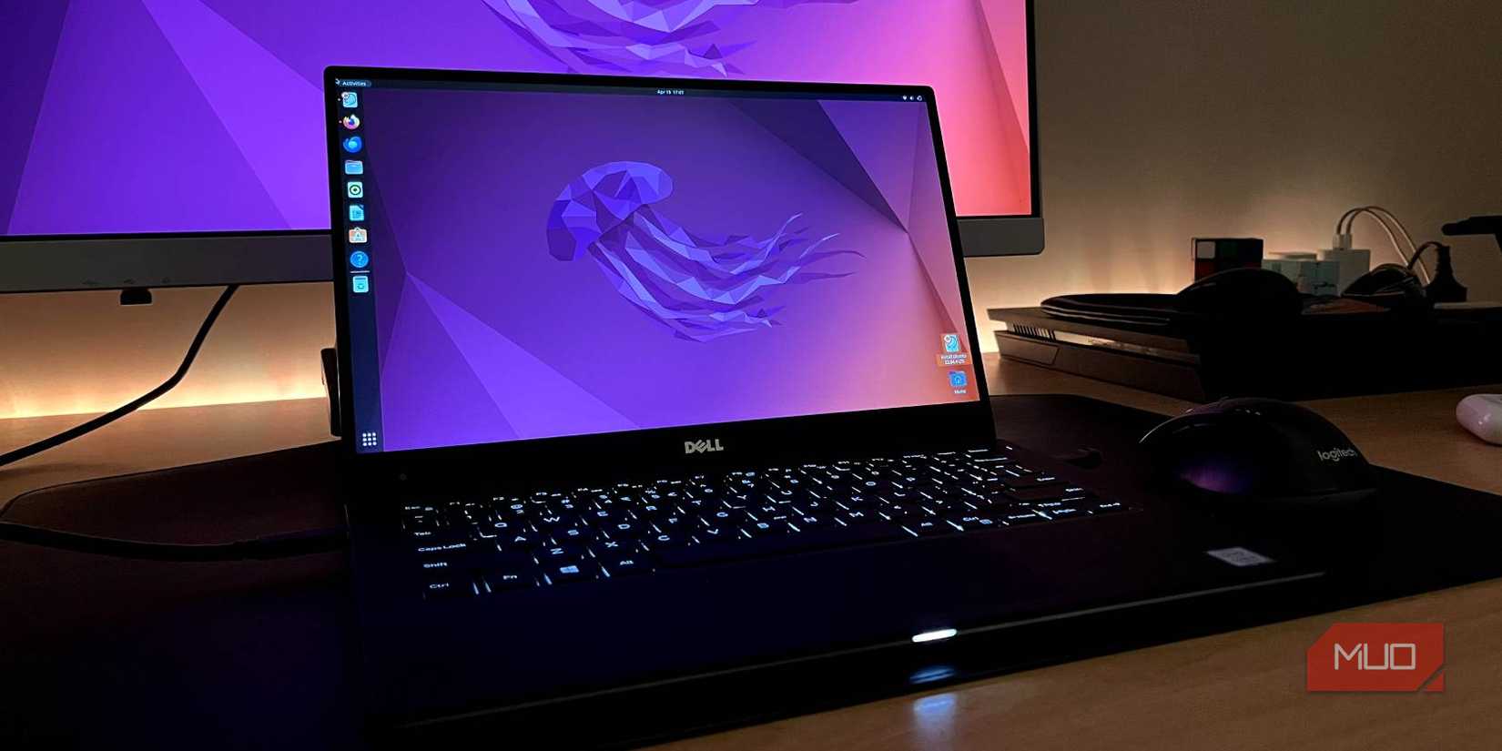 Dell XPS 13 running Ubuntu with a monitor in the background