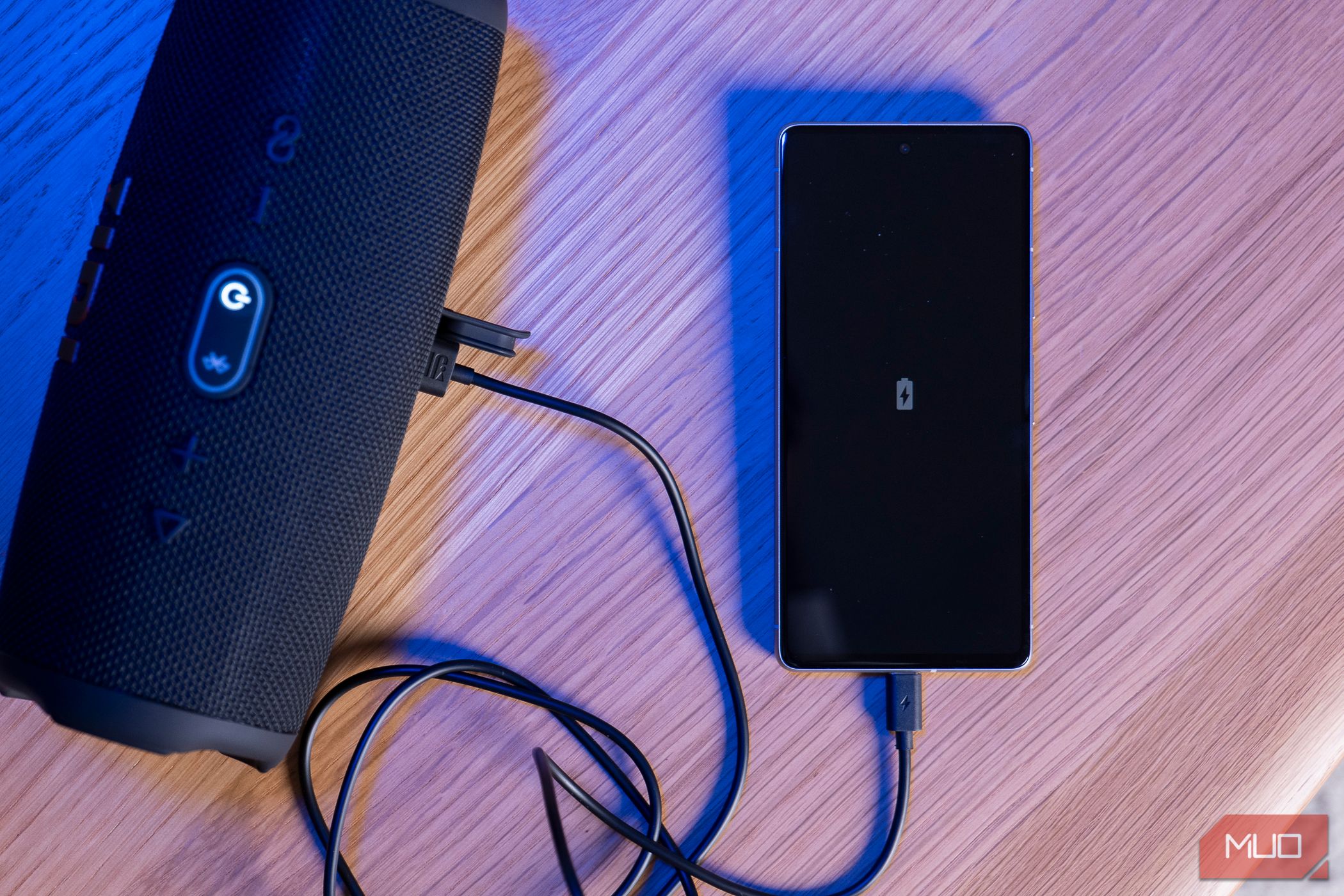 The JBL Charge 5 charging a phone