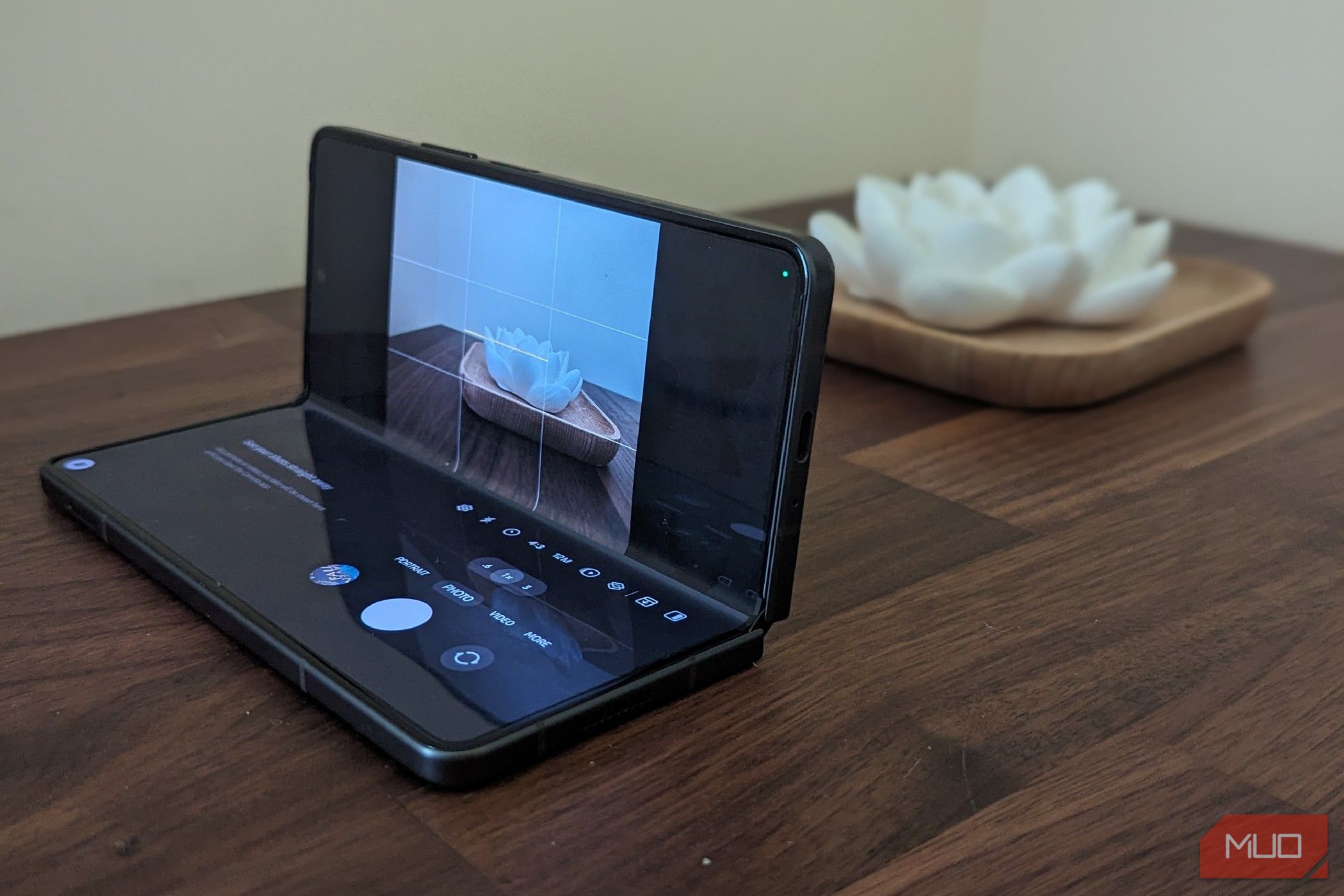 Taking a picture with a folded Galaxy Z Fold 5 on a desk.