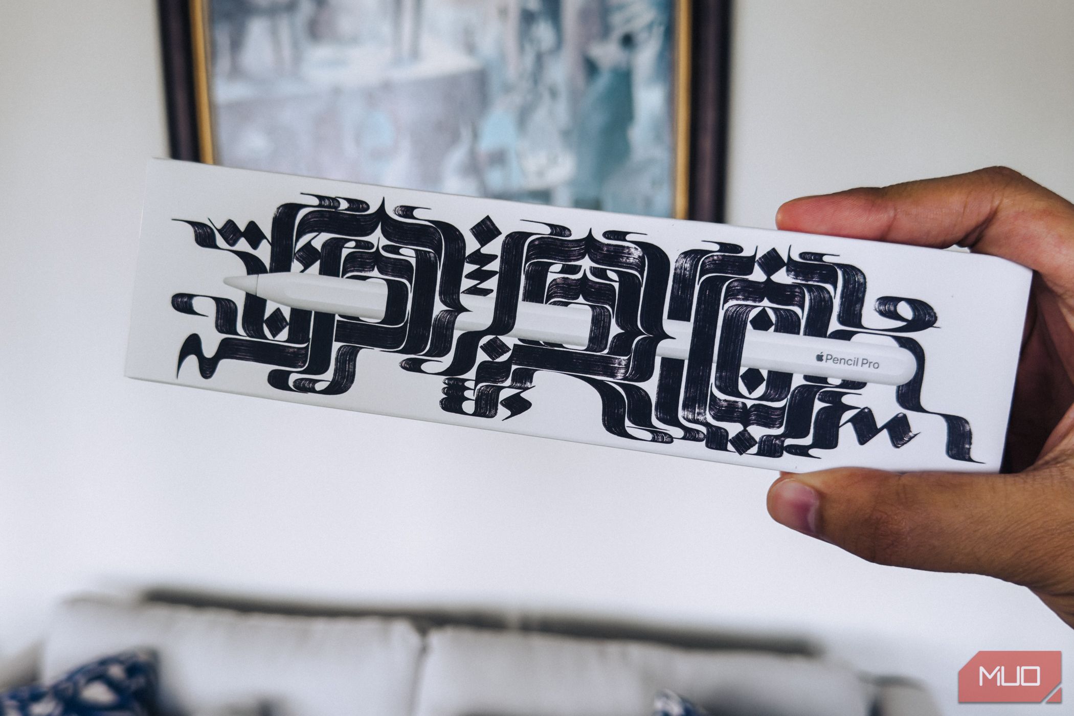 Person holding an Apple Pencil Pro Box