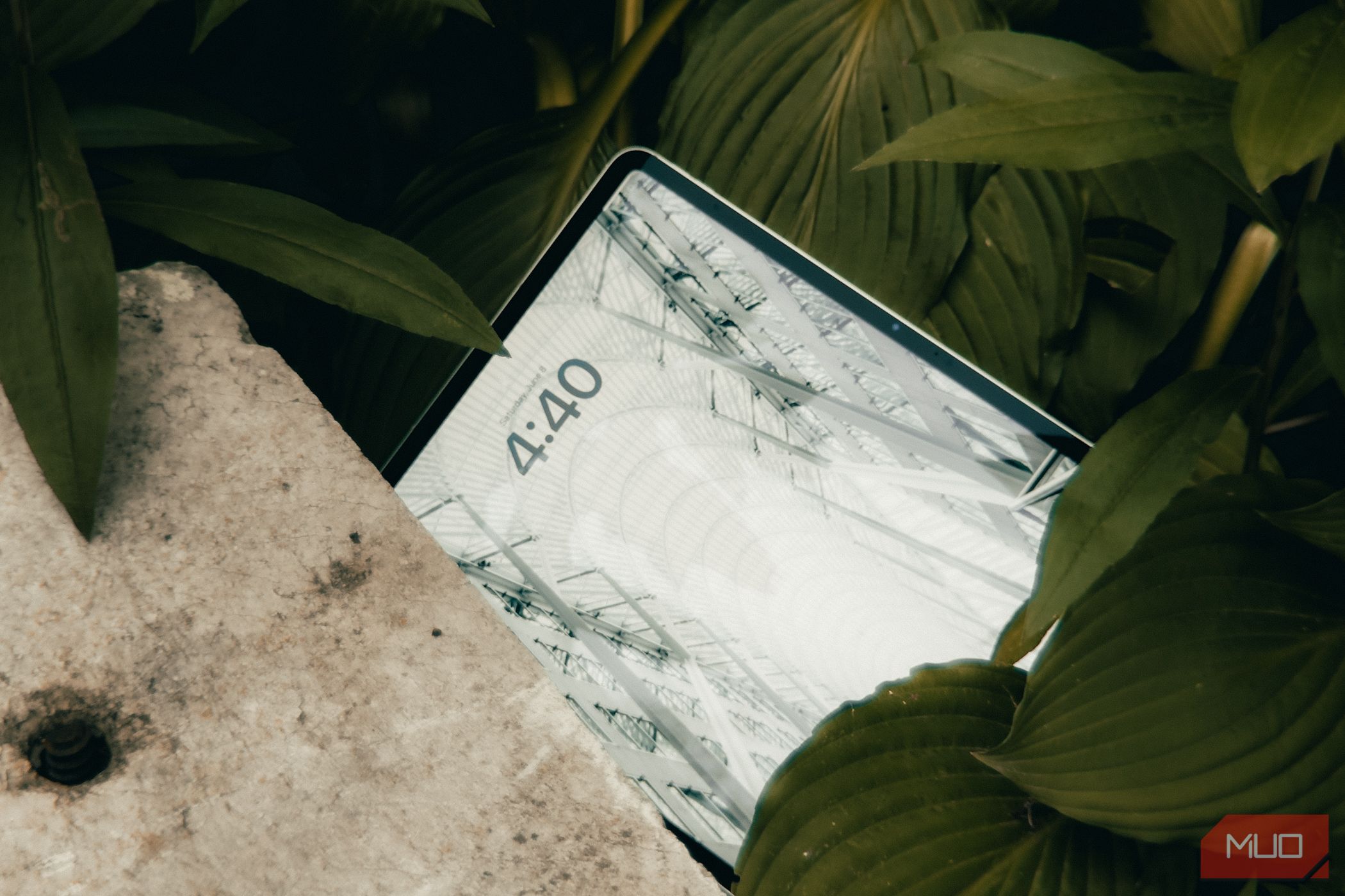 Apple iPad Air M2 laying on the ground with its display turned on