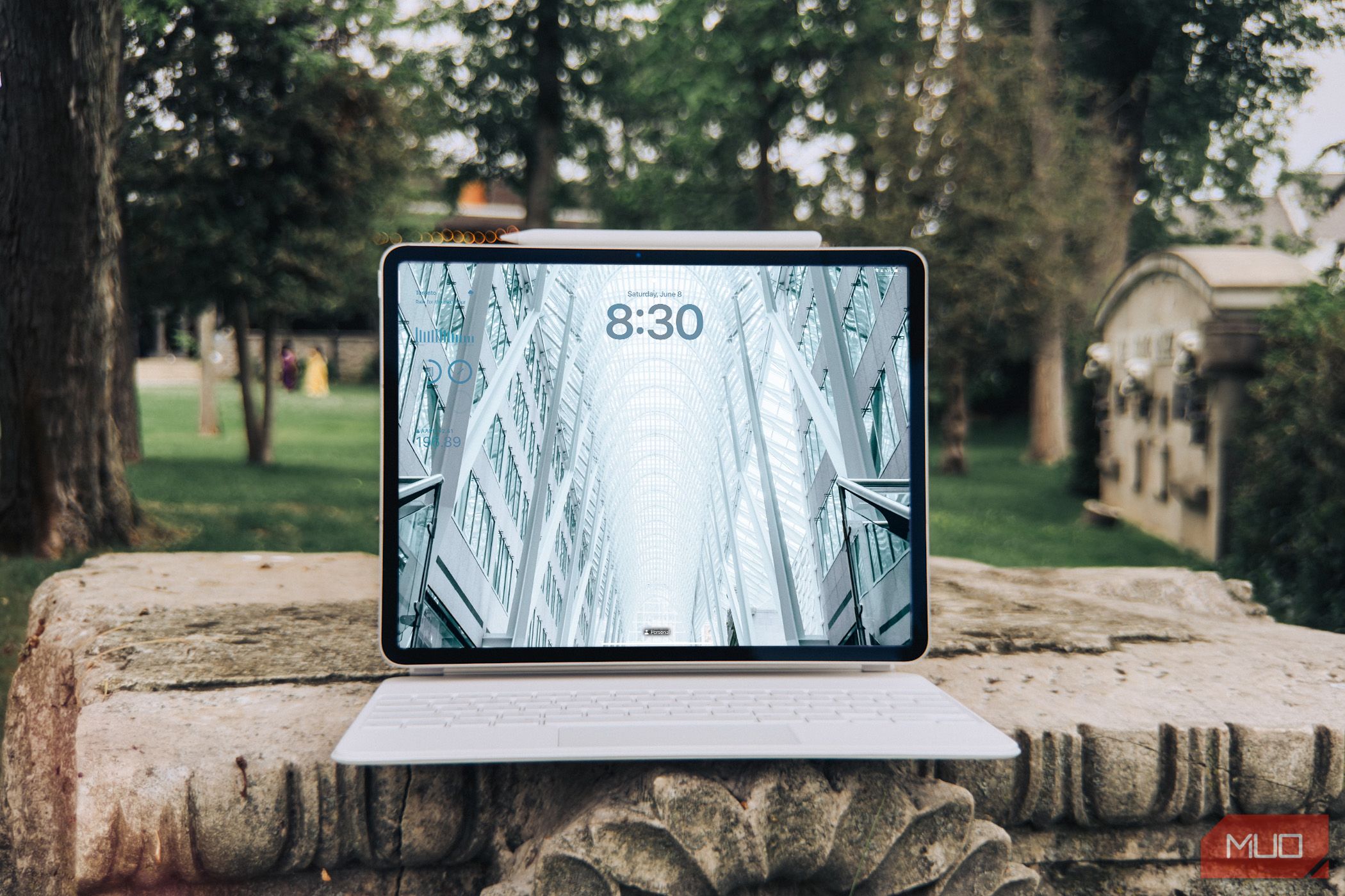 Apple iPad Air M2 connected to the Magic Keyboard showing the lock screen