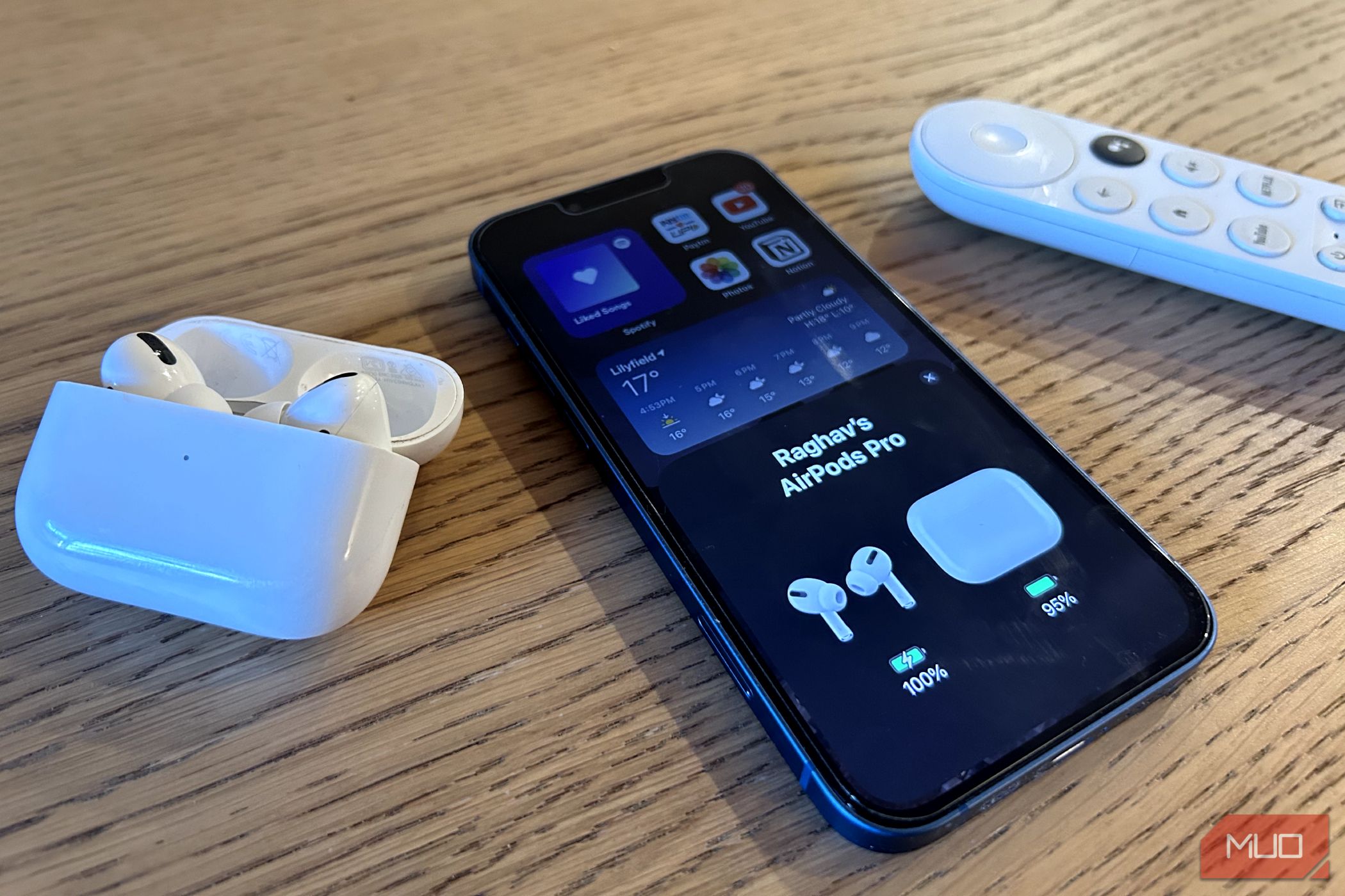 iPhone, AirPods and a Google Chromecast Remote on a table