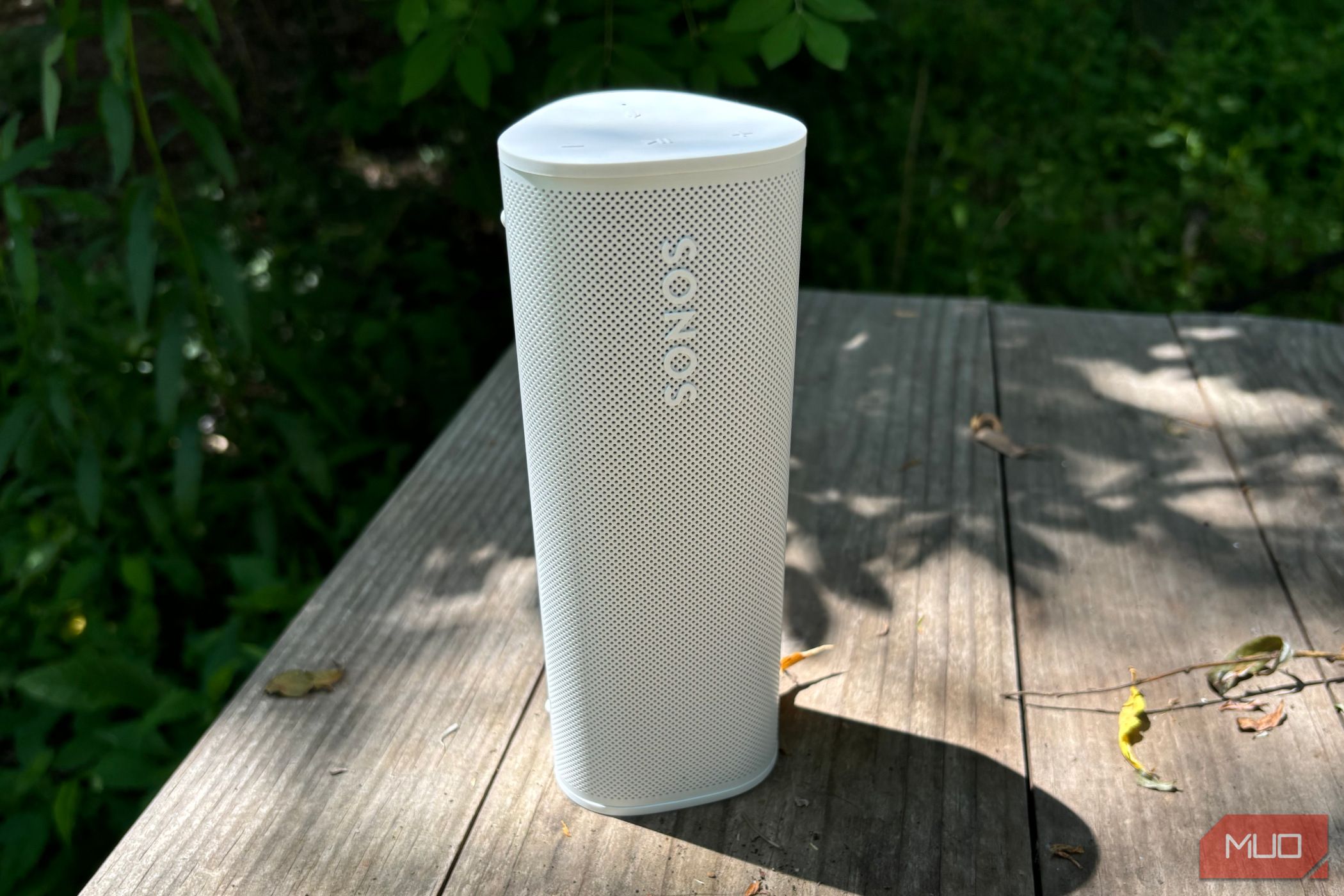 Sonos Roam 2 sitting outdoors in the vertical orientation