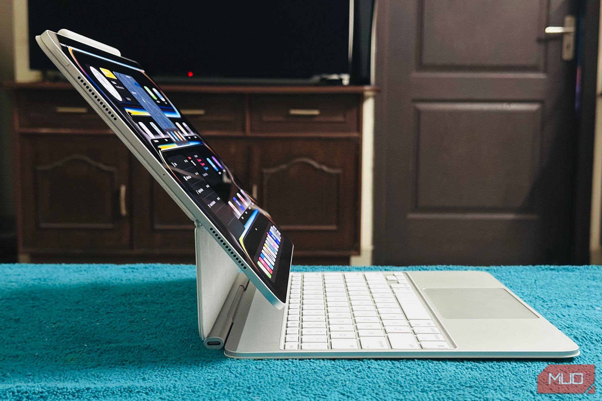 An iPad Pro attached to a white Magic Keyboard