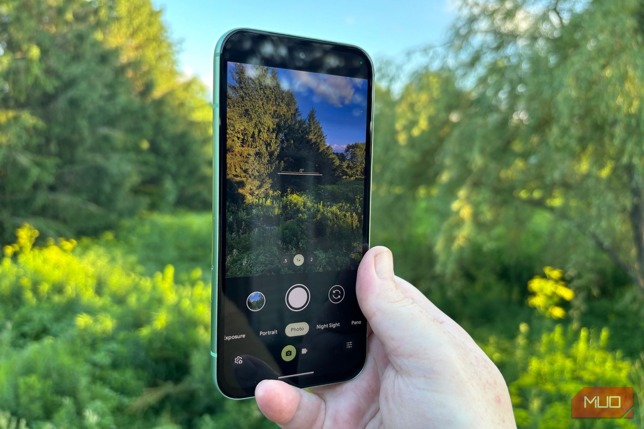 Person taking a photo with the Google Pixel 8a