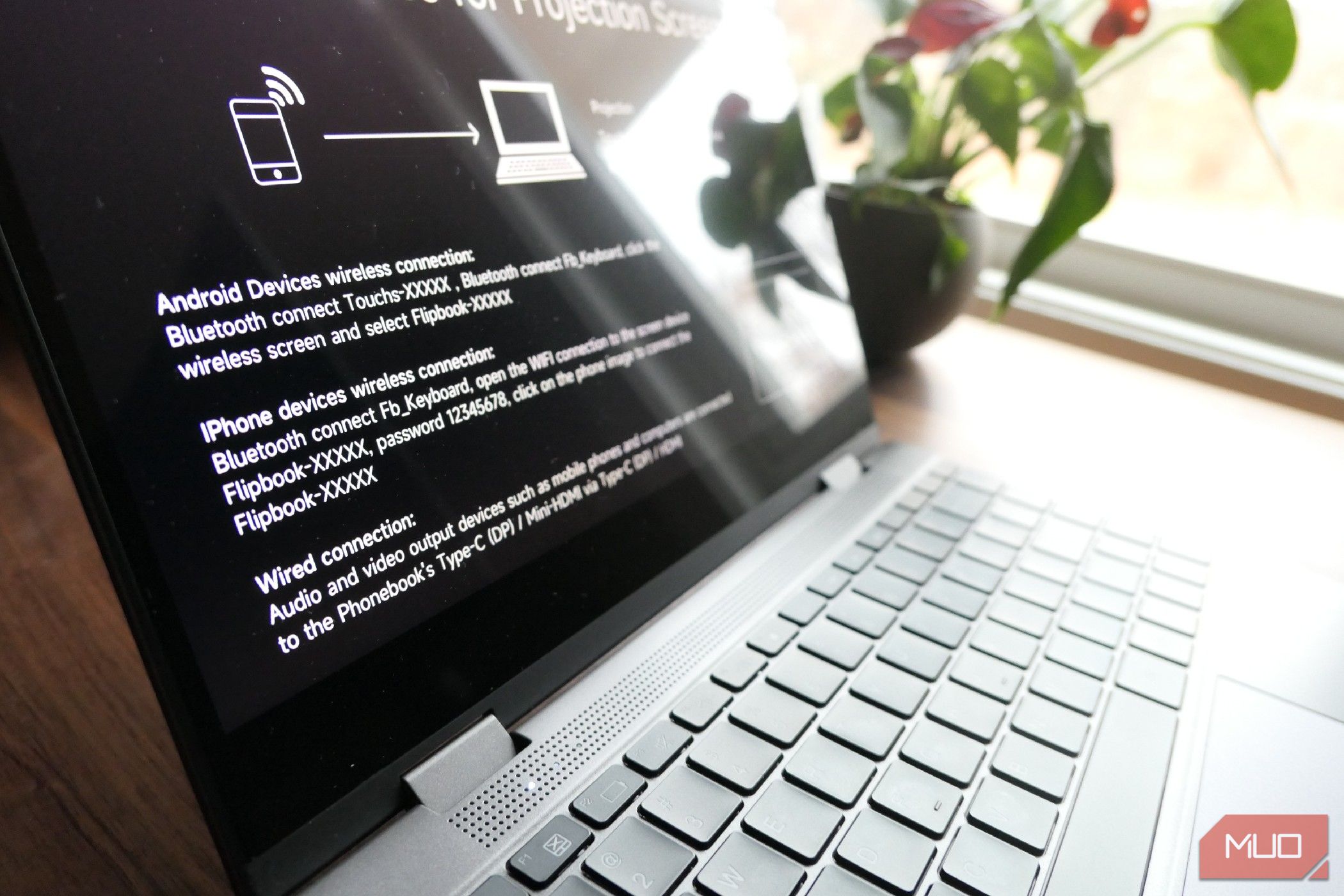 Lapdock sits on a desk next to a window.