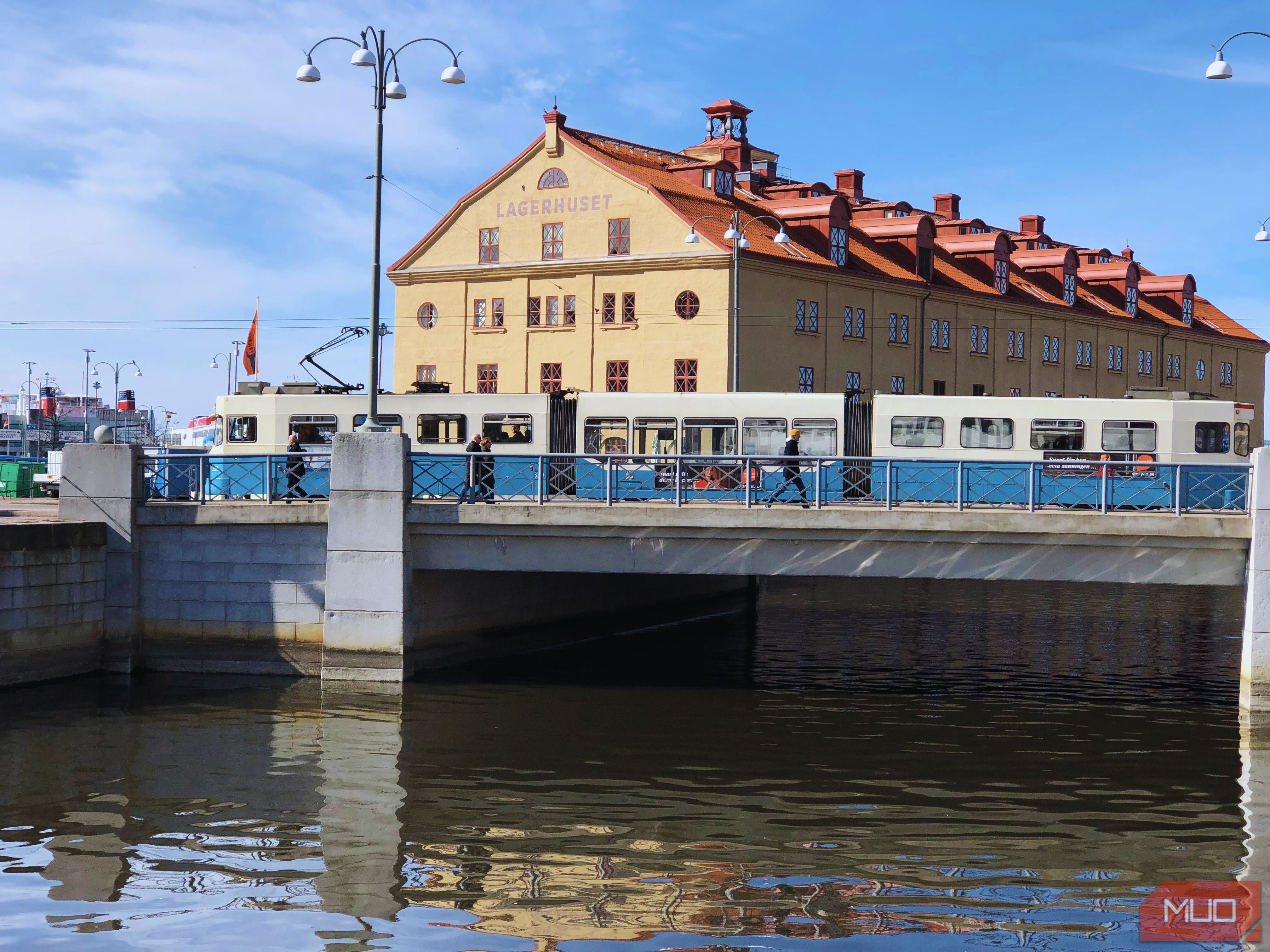 A Canva retouched image of a city and a tram