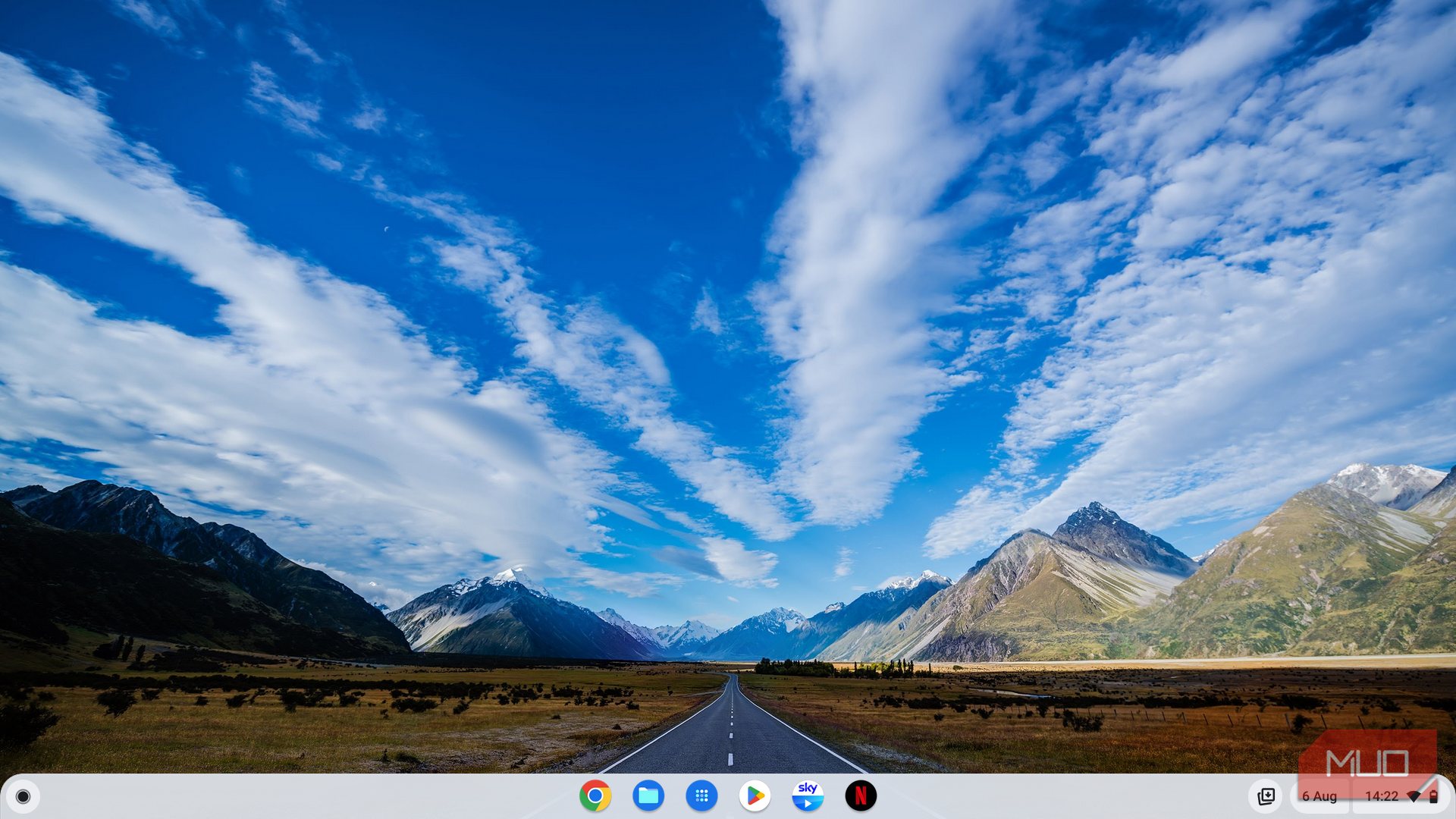 The simplicity of the ChromeOS homescreen showing a wallpaper of a US landscape and a small dock for launching apps at the bottom