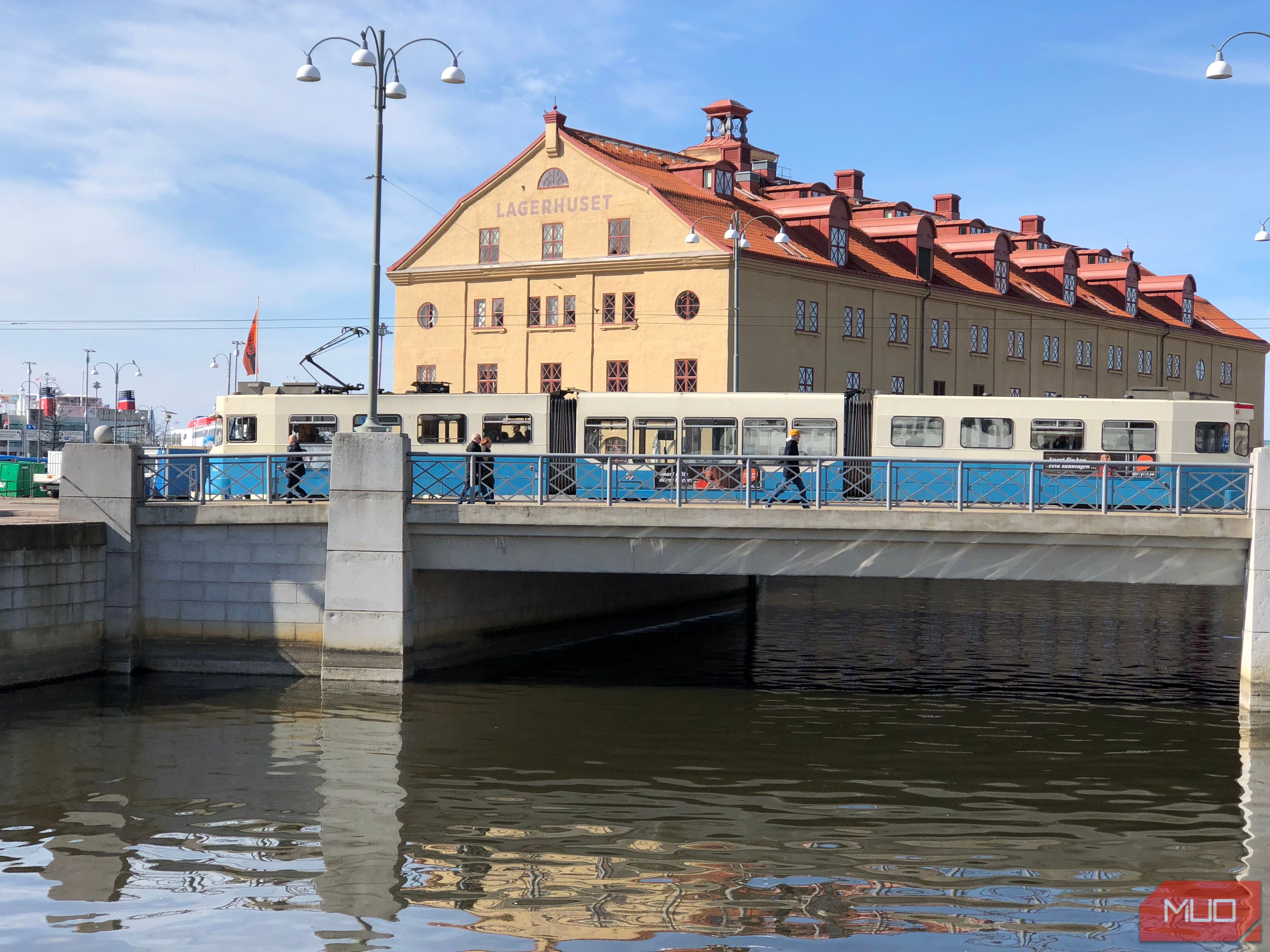 A tram crosses a bridge in the city center