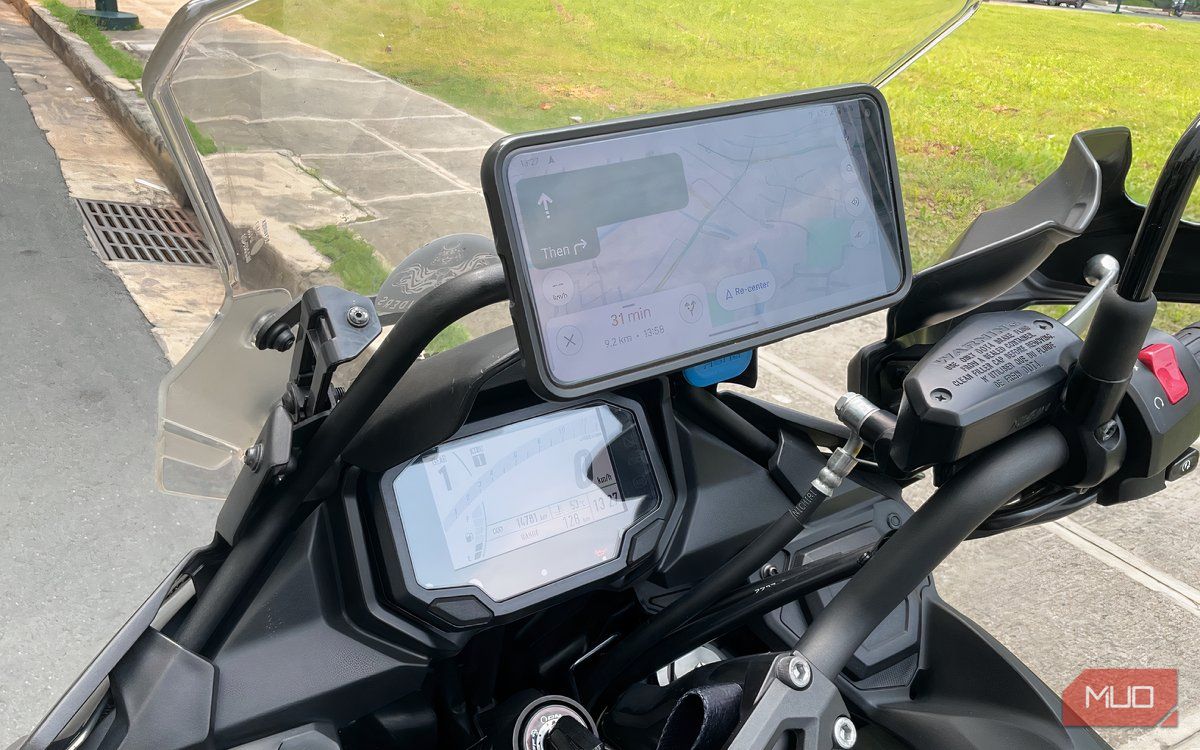 A phone mounted to a Quad Lock on a motorcycle.