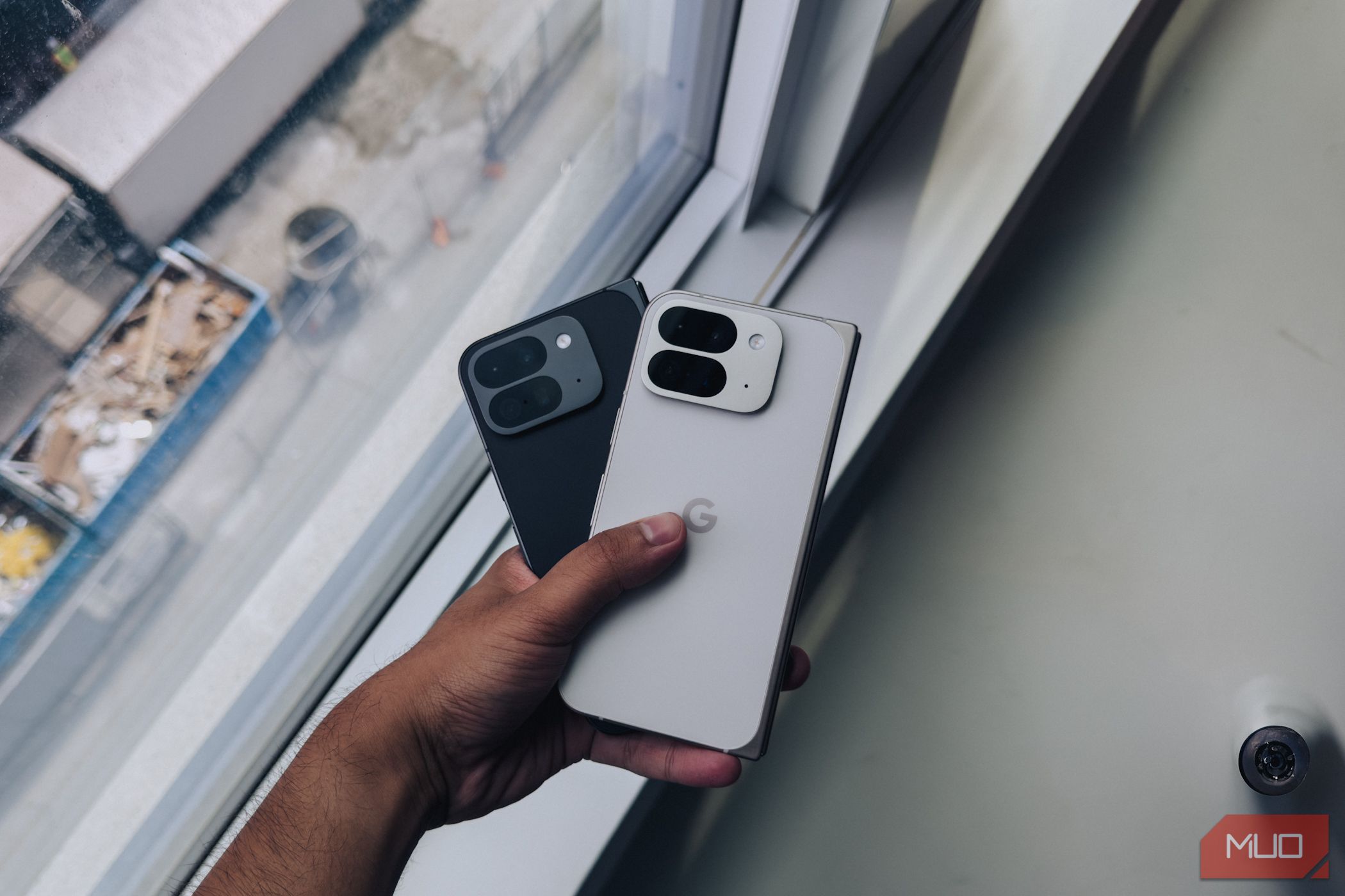 Pixel 9 Pro Fold in White and Black in hand