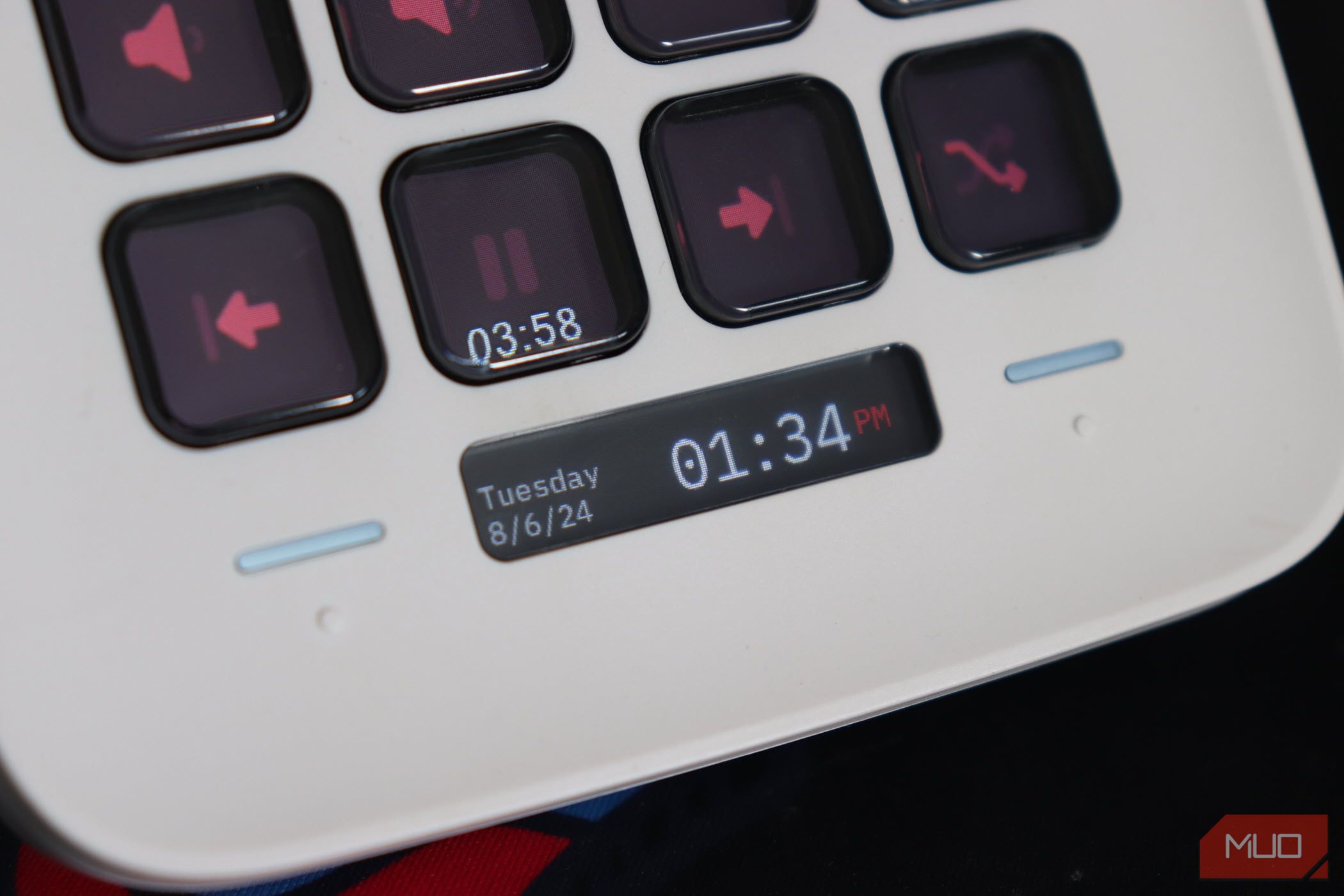 A close-up of the lower half of the Stream Deck focuses on its clock and date display.