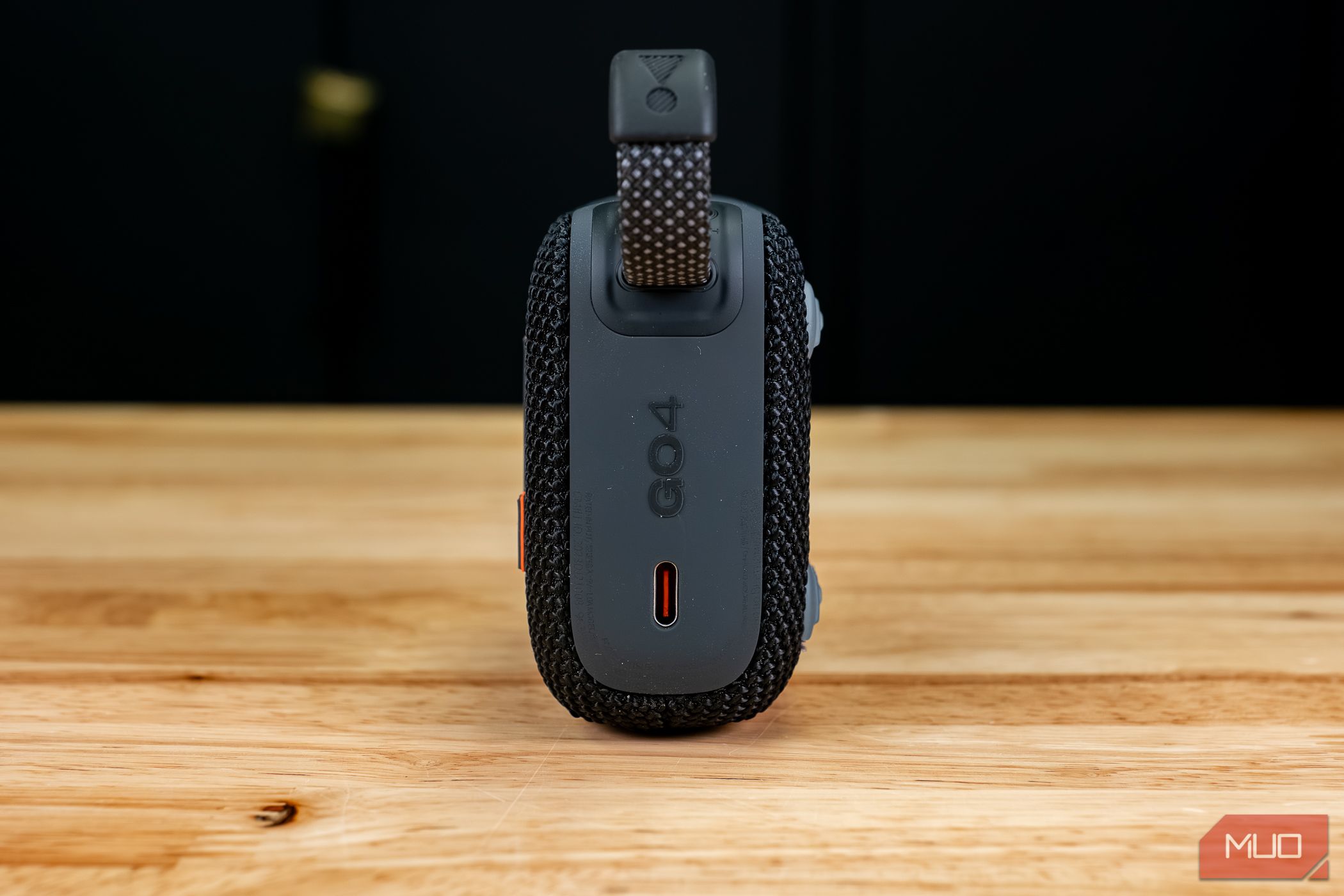 The JBL Go 4 charging port on table 