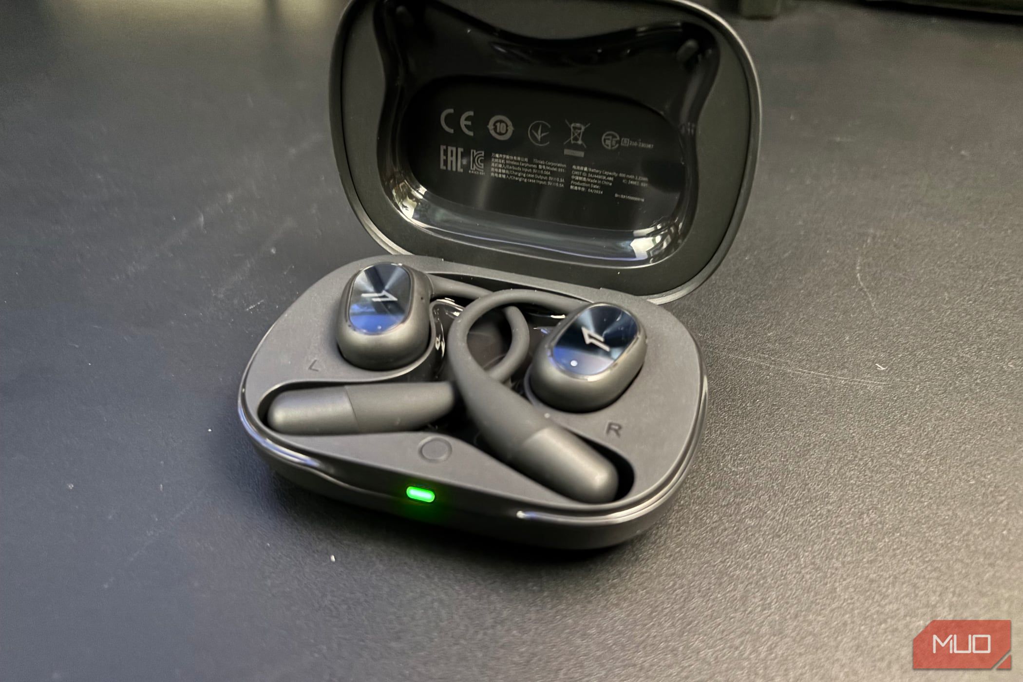 1MORE Fit SE S31 earbuds charging in their case