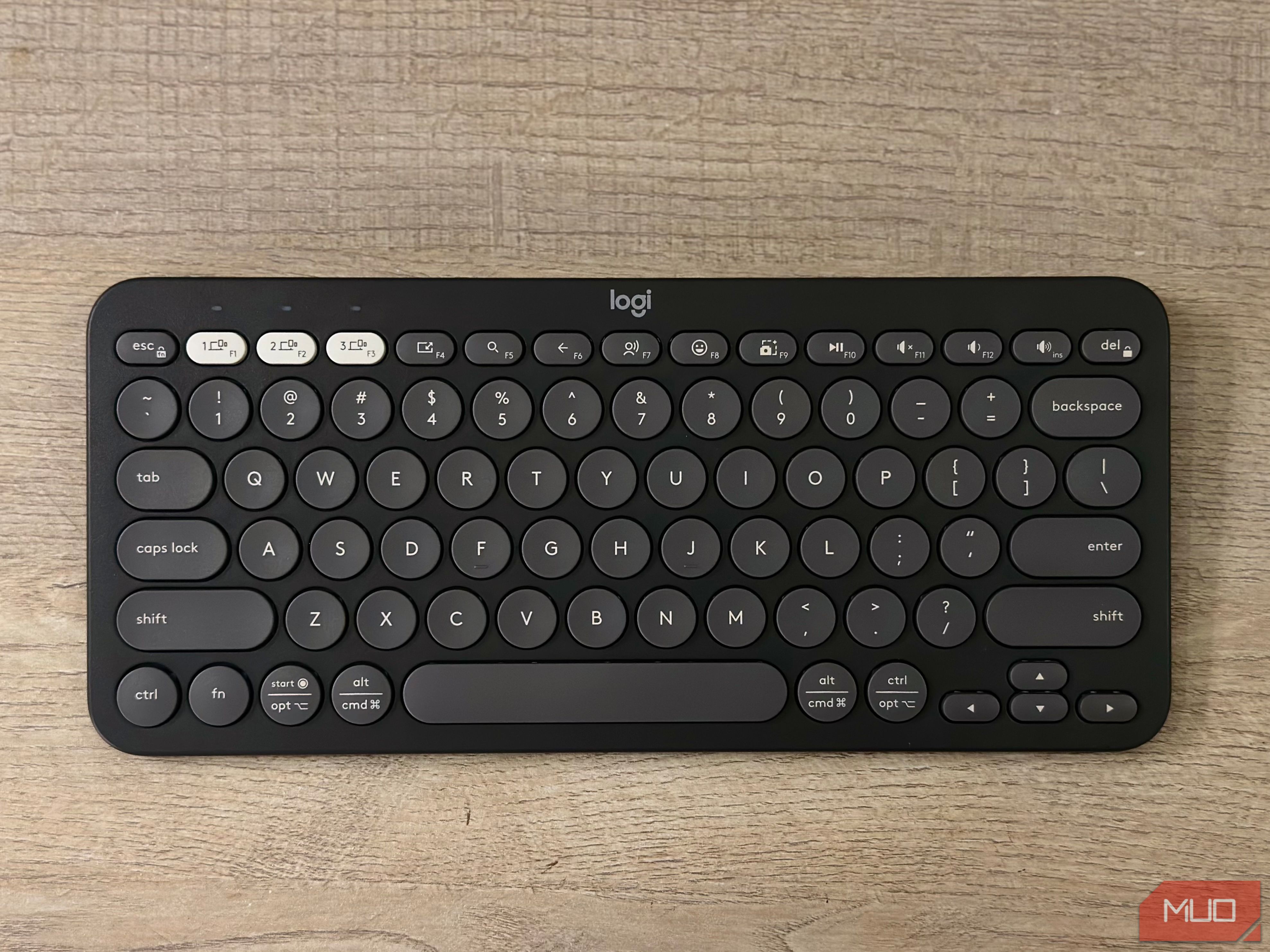 A Logitech Pebble 2 keyboard resting on a table