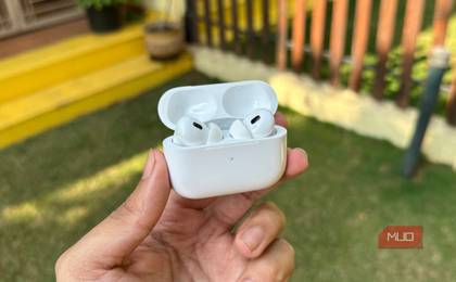 AirPods Pro 2 with case open being held in a man's hand