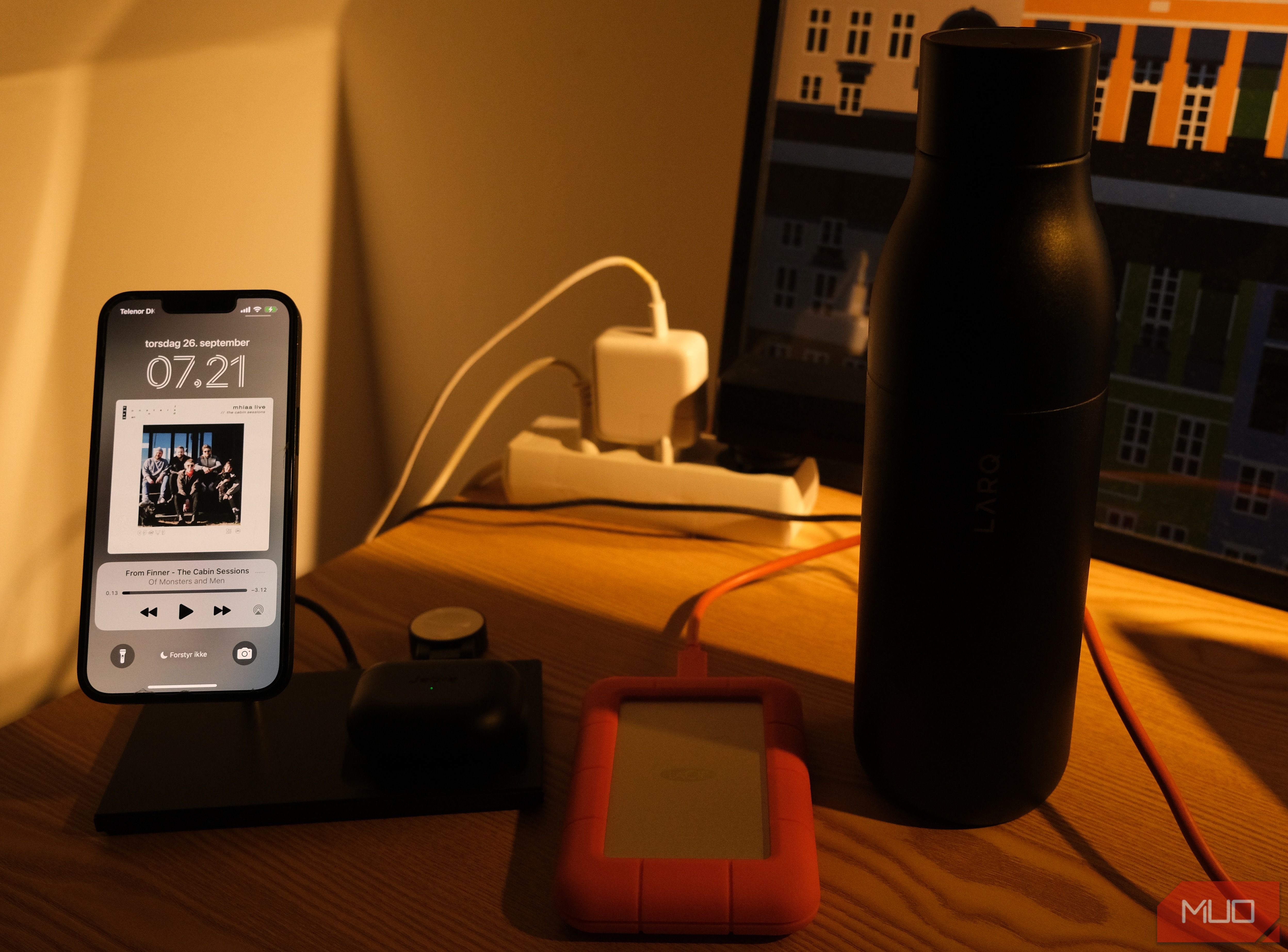 A photo of an iPhone charging on a Native Union charging station