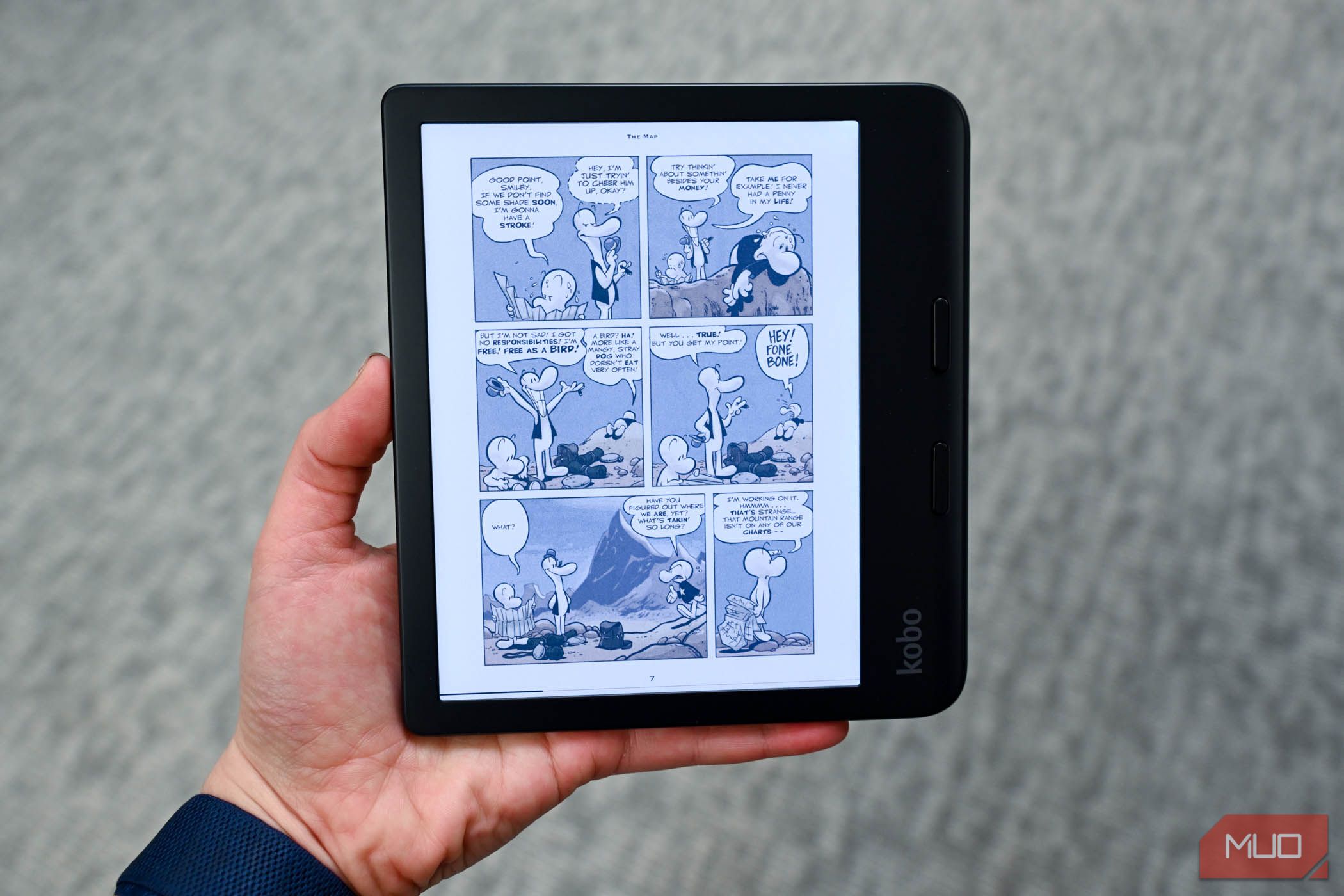 Person reading the comicbook Bone on the Kobo Libra Colour