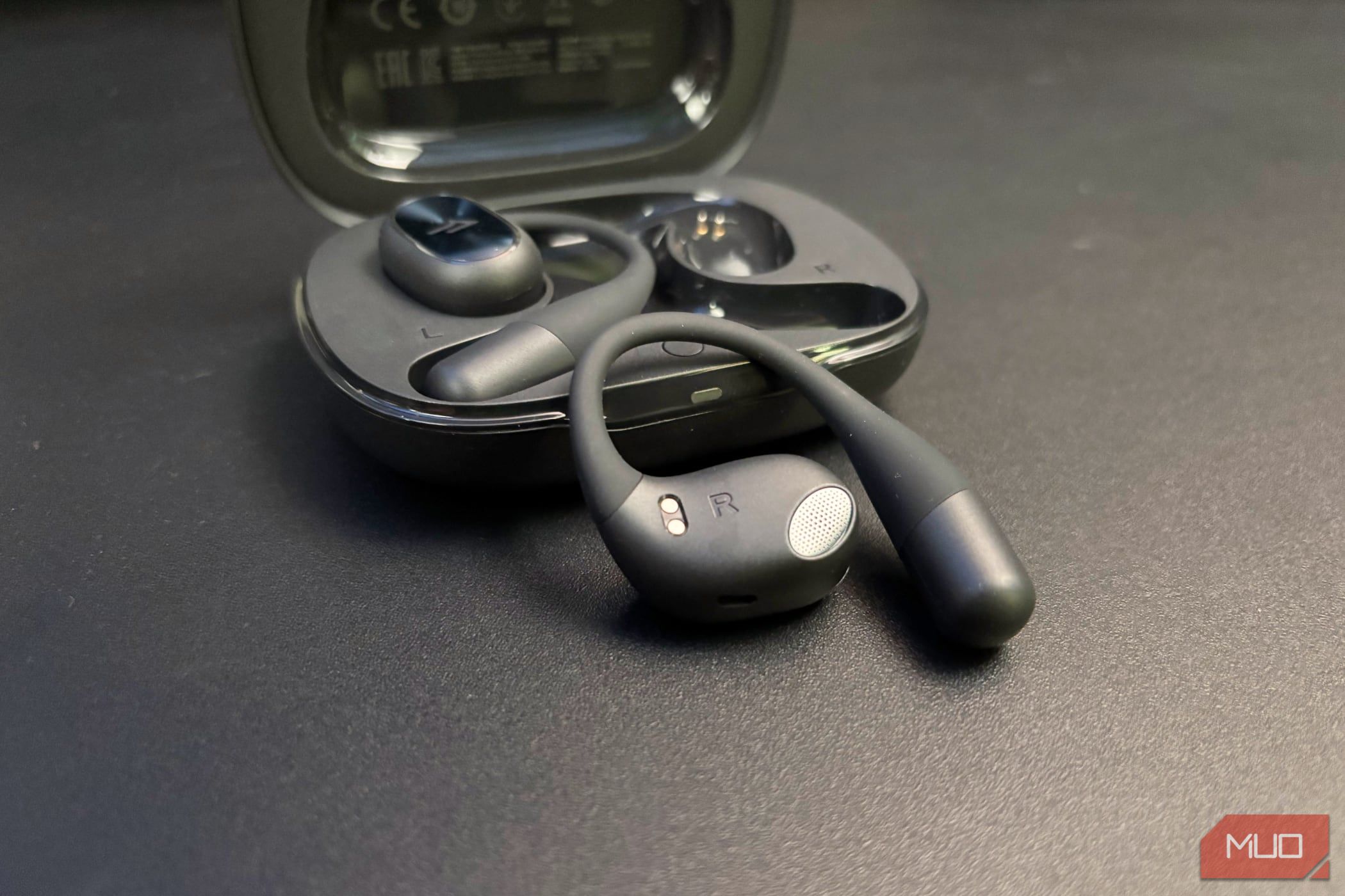 Right 1MORE Fit SE S31 earbud sitting outside of the case