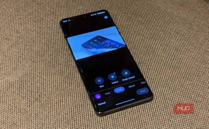 phone kept on a fabric surface with google photos edit menu open showing its tools tab