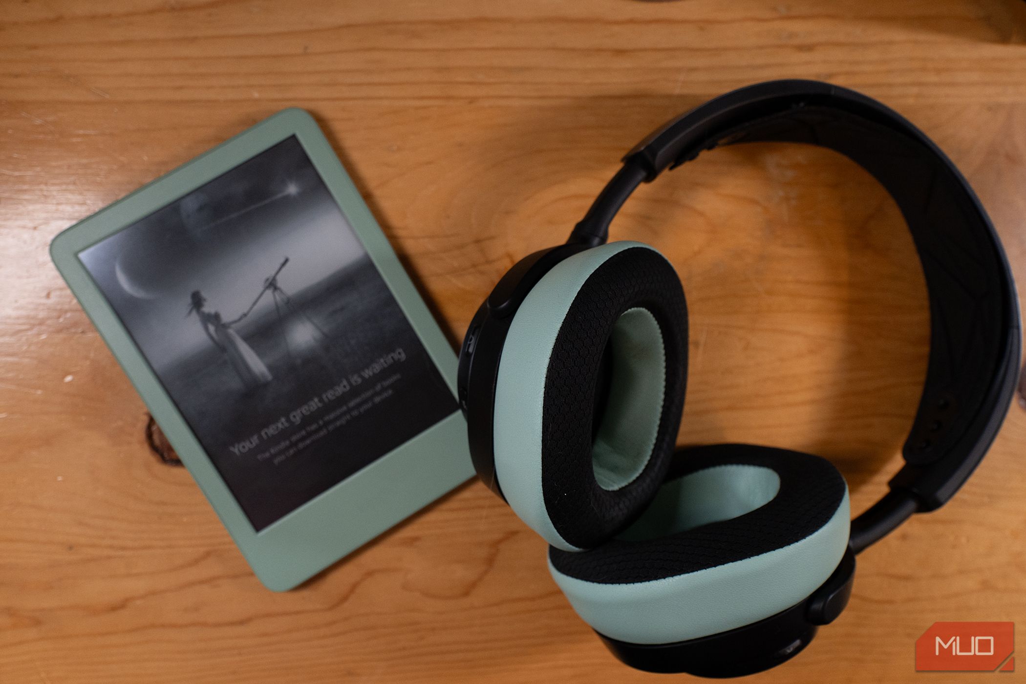 2024 Kindle in Matcha with similarly colored headphones.