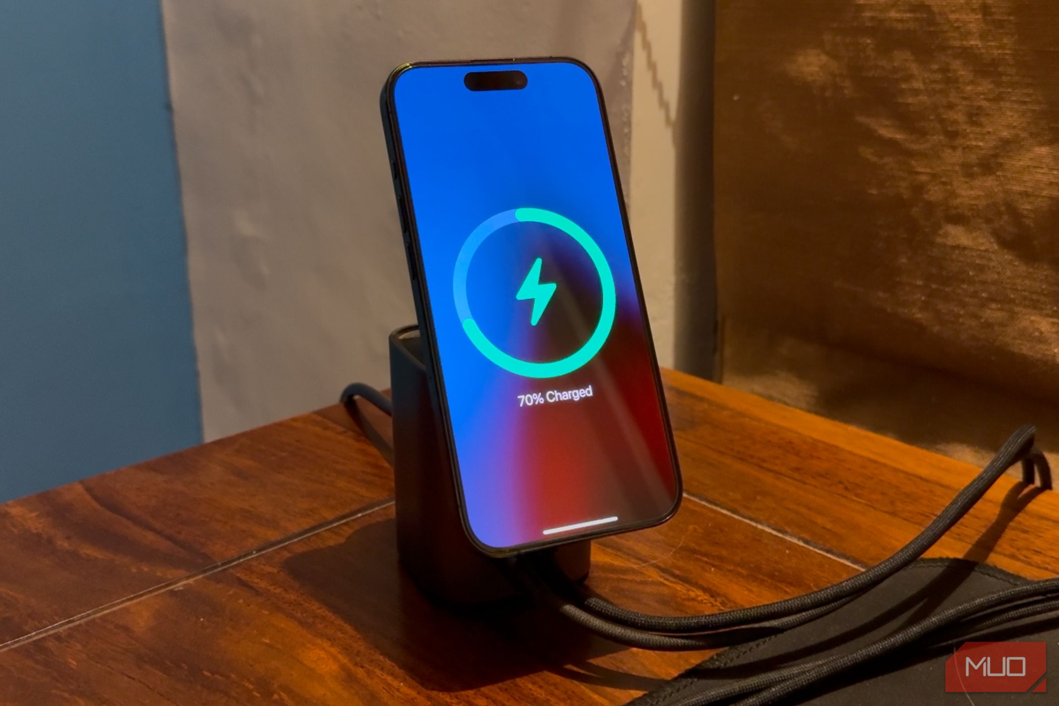 an iphone mounted on a magsafe wireless charger kept on a table