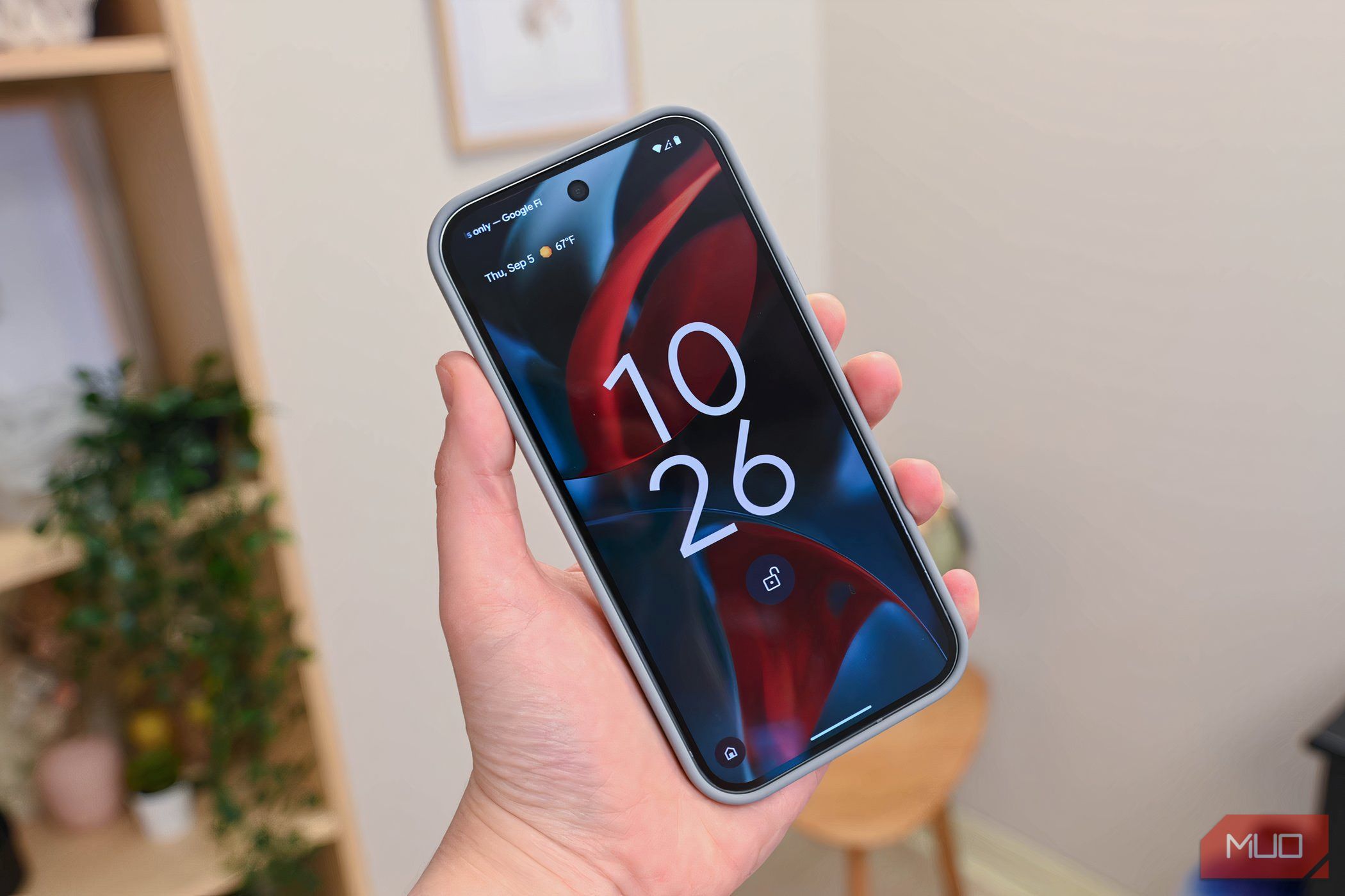 Holding a Google Pixel 9 Pro in hand