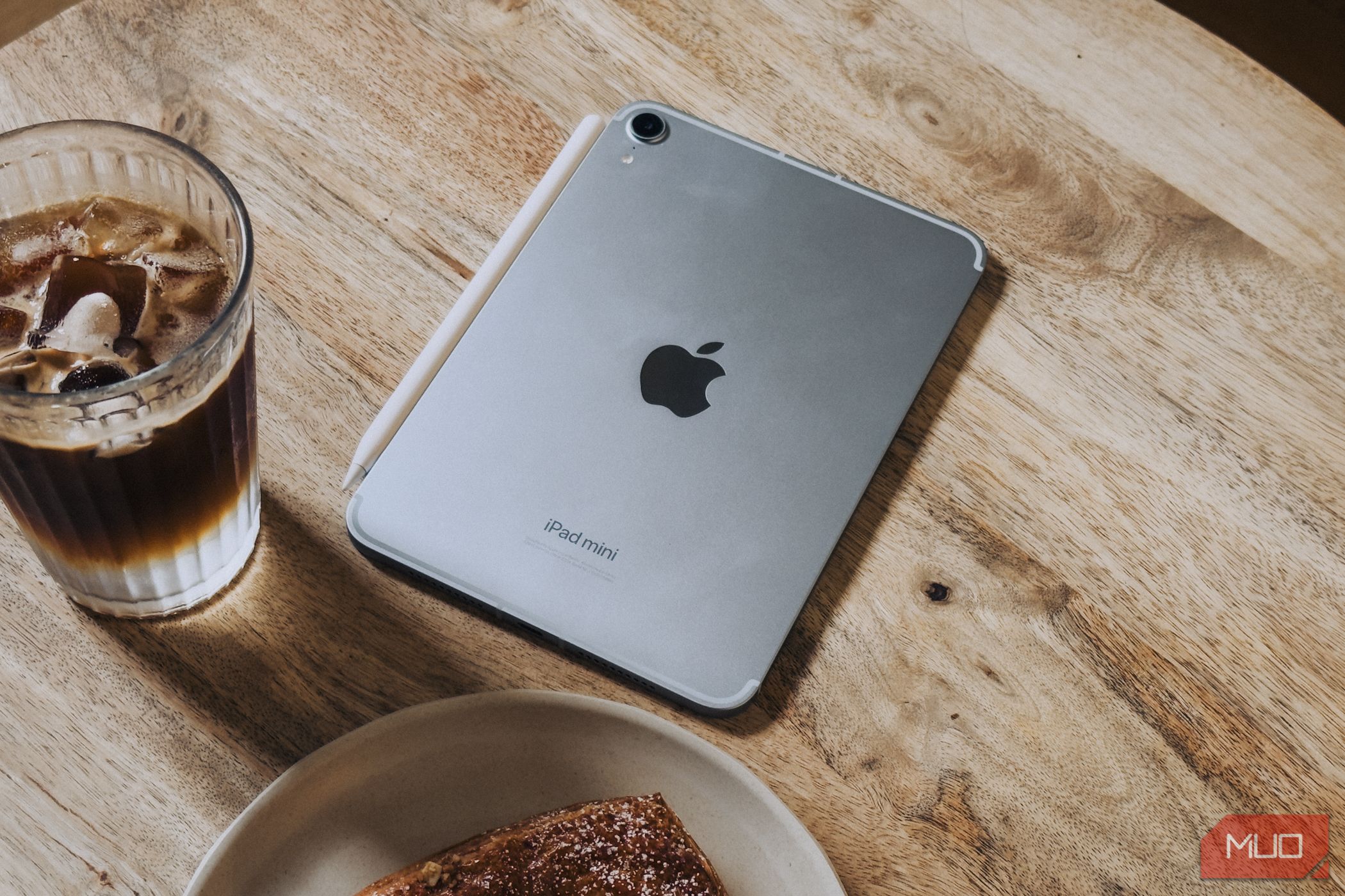 iPad mini (A17 Pro) on coffee table next to food