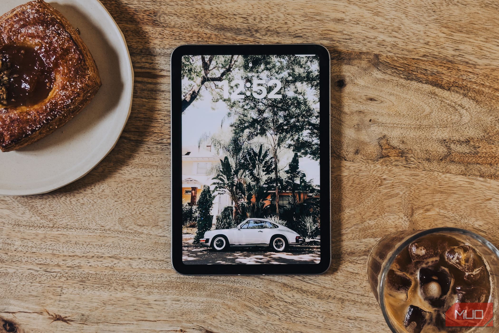 iPad mini (A17 Pro) screen on a coffee table (straight on)